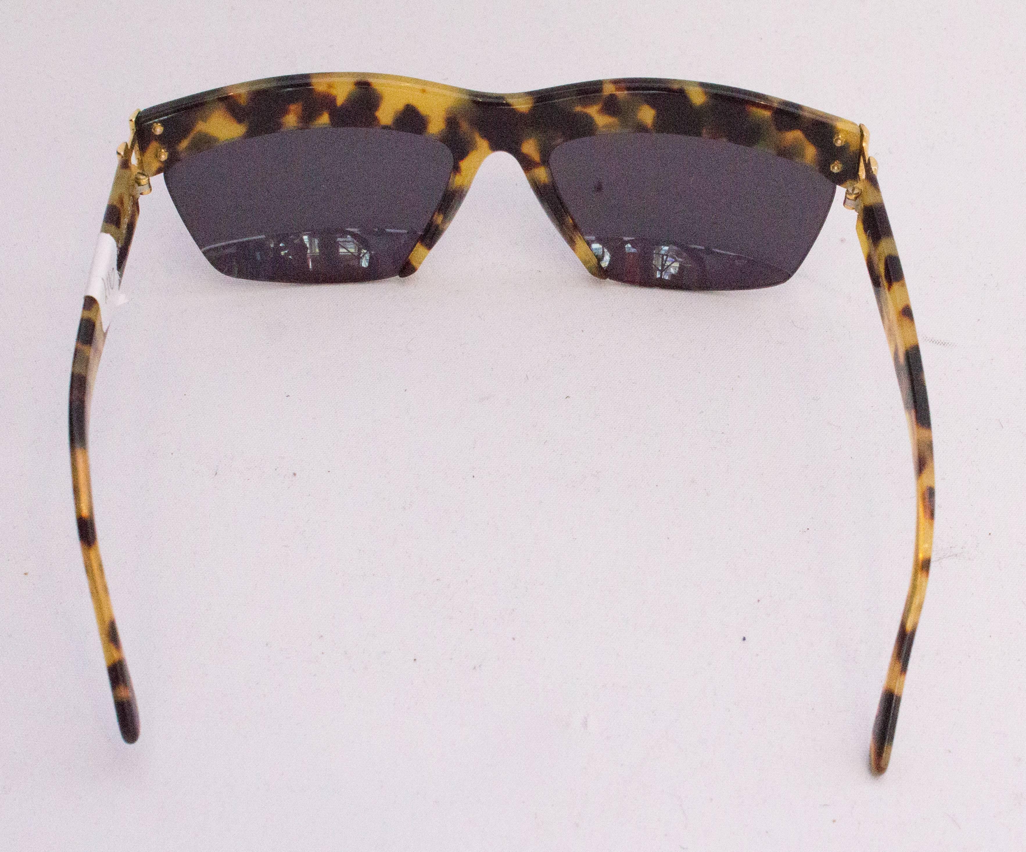 Black A pair of Vintage 1970s Sunglasses by Charme For Sale