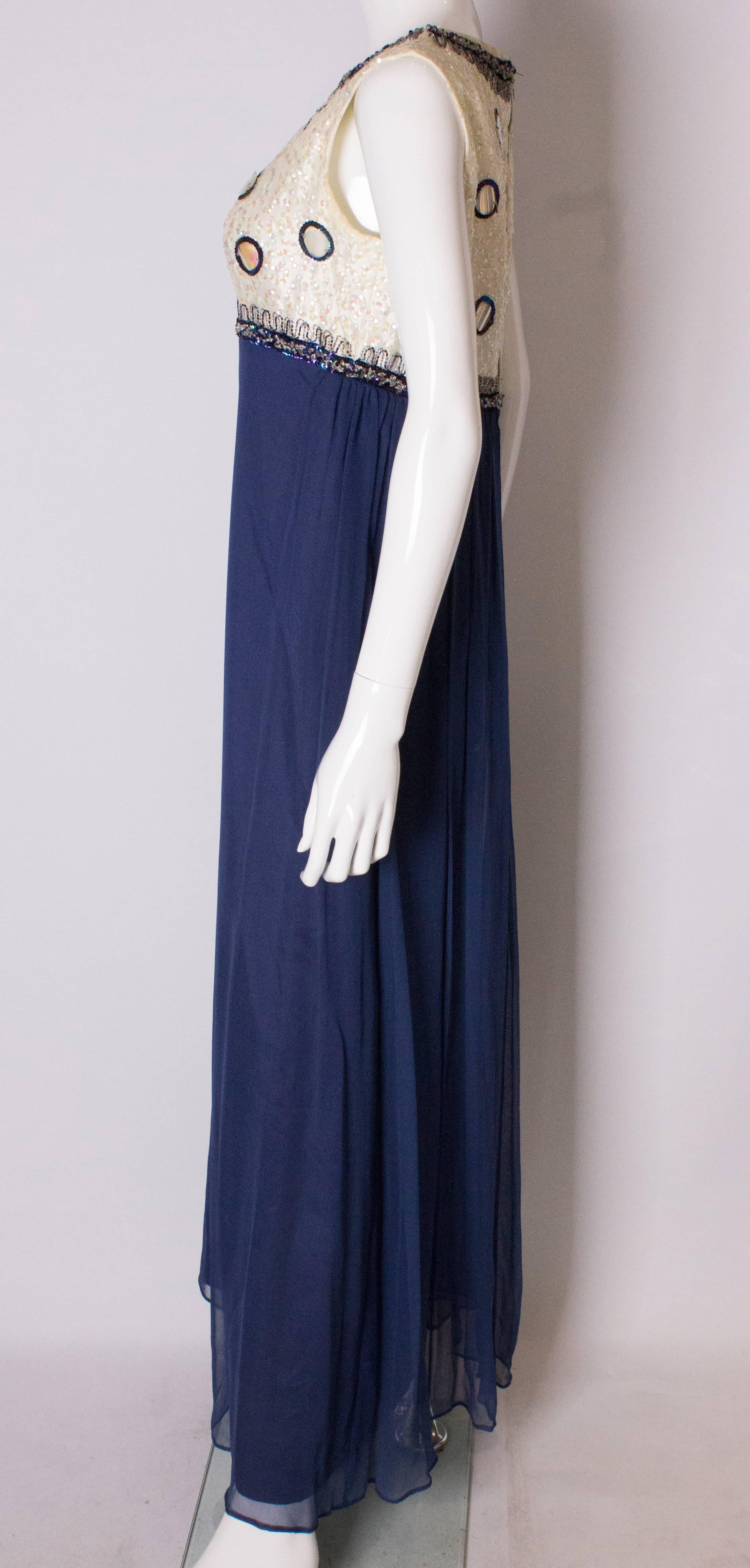 Women's A Vintage 1960s sequin blue chiffon evening gown by Laura Phillips