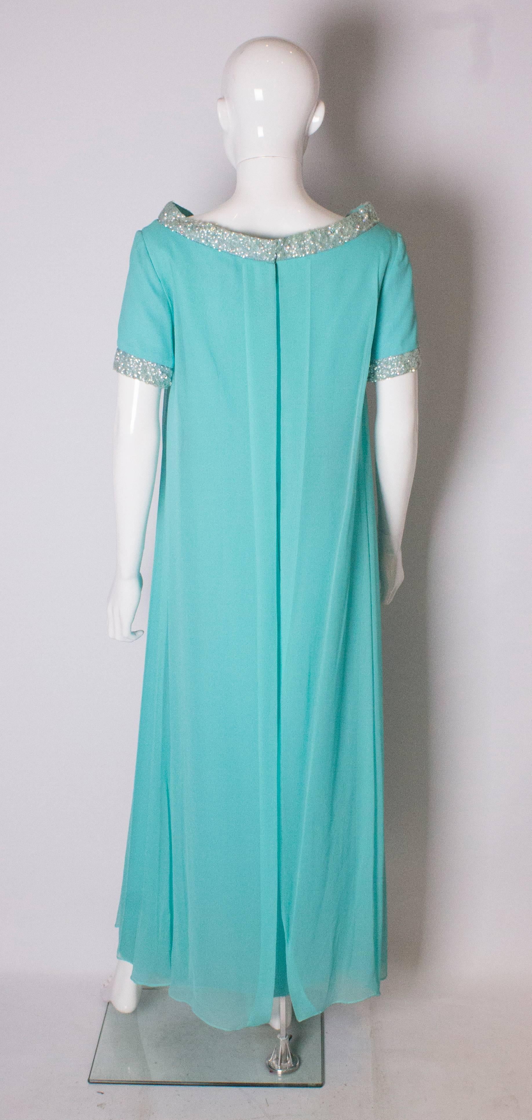 A Vintage 1960s pale blue evening gown by Polmarks Models 2