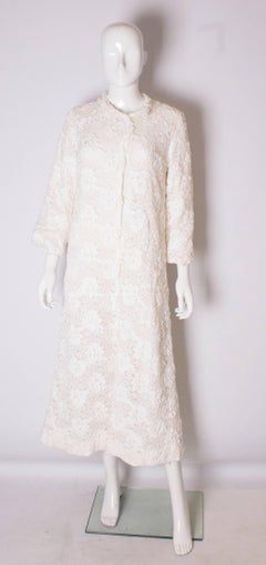 A Vintage 1960s White Ribbonwork summer Coat