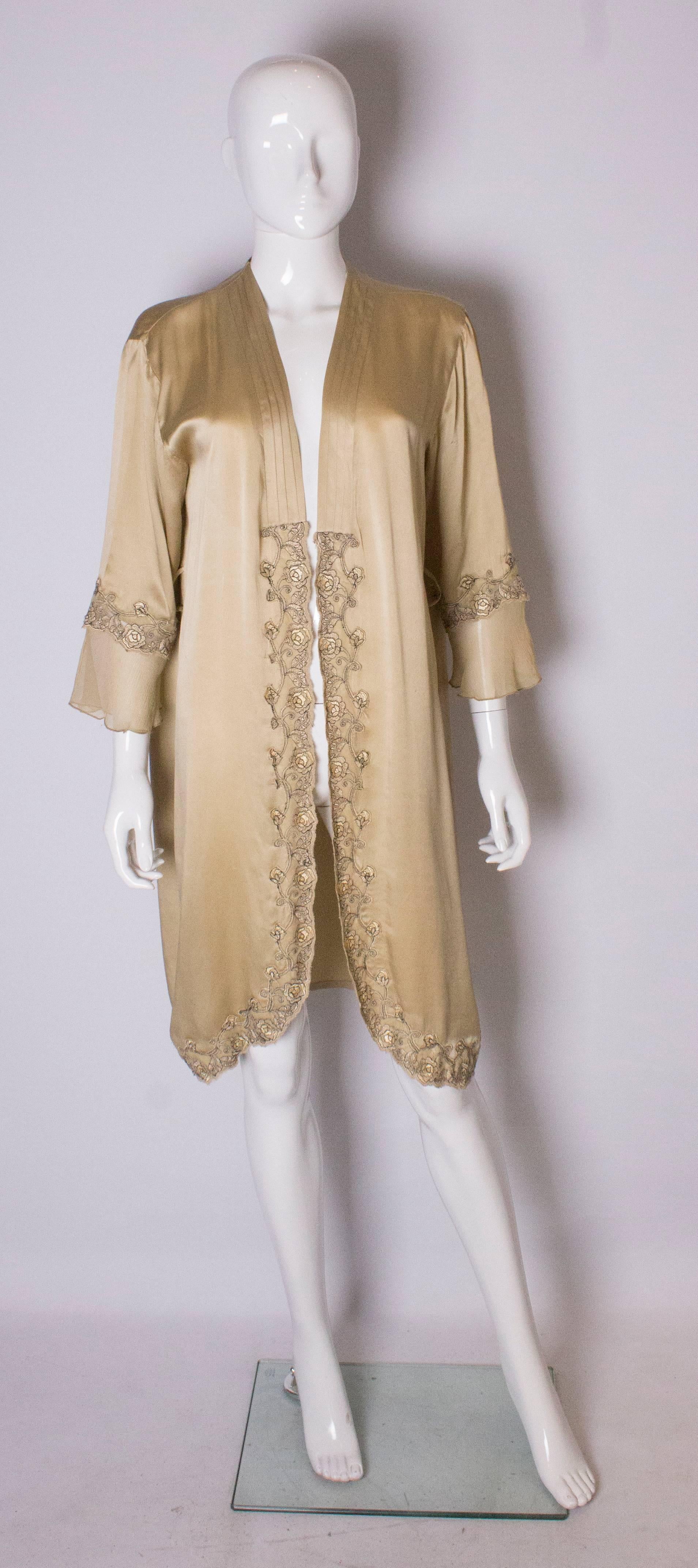 A lovely lingerie robe or loose jacket for Summer. The robe has pleats on the front, and a  lovely black lace detail on the front and cuffs.