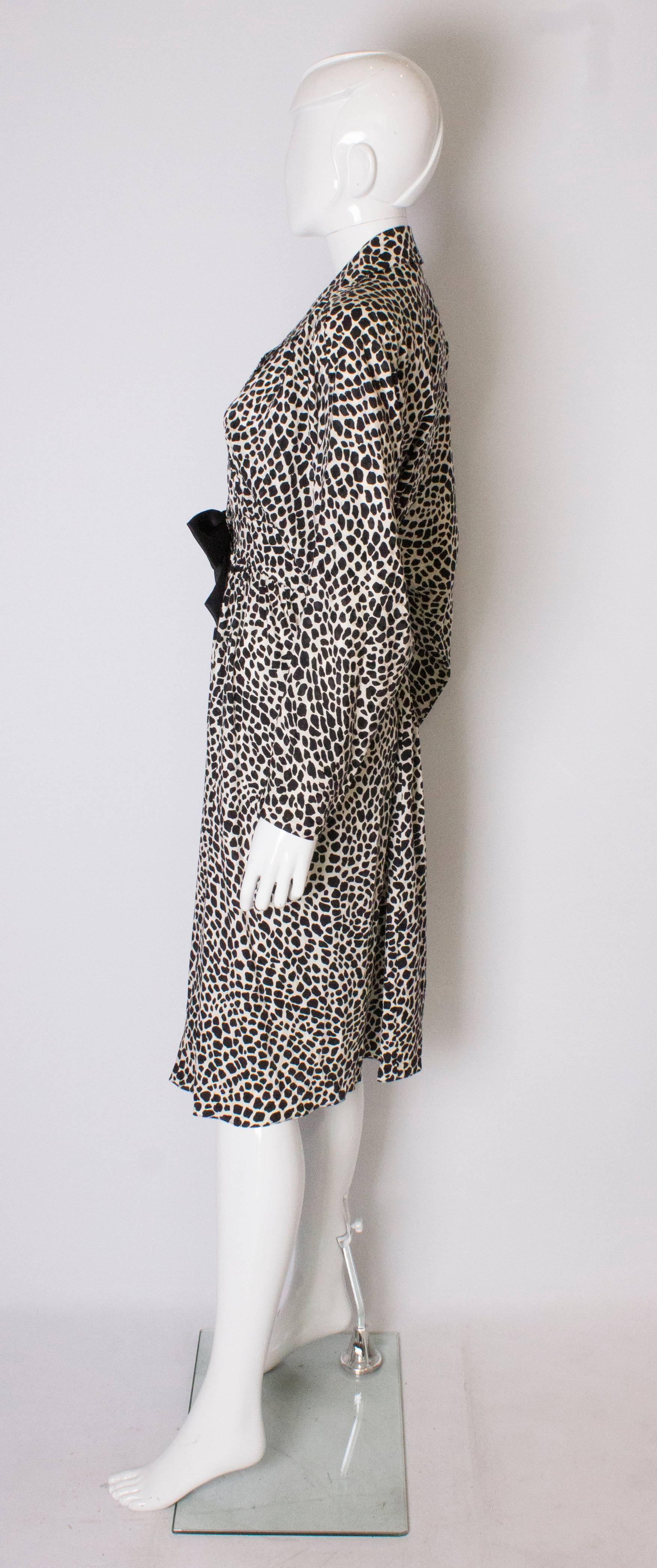 A Vintage 1980s Black and White printed Dress with bow detail by Adele Simpson 1