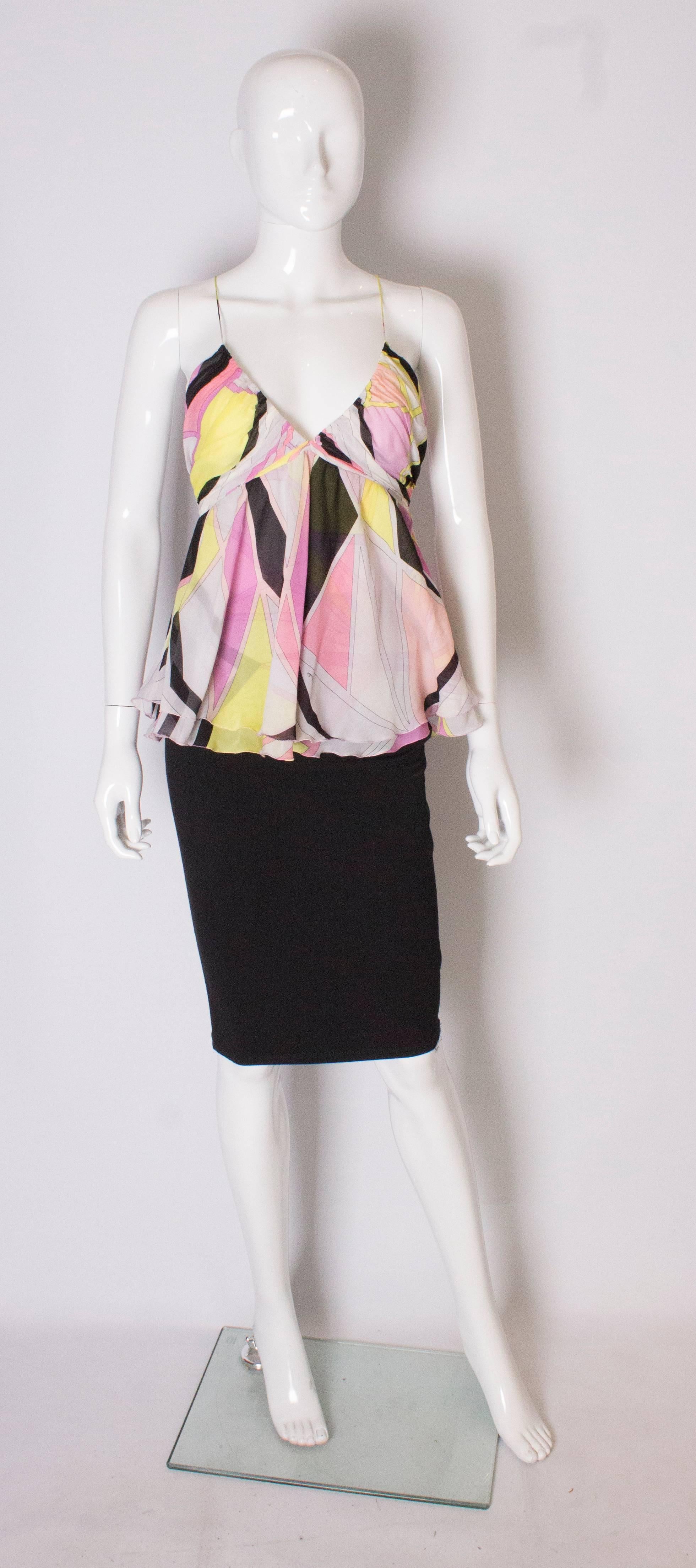 A pretty Pucci silk, top. This top in typical Pucci colours is made of two layers of silk, and has a v neckline, gathering over the bust, a side zip and spagetti shoulder straps.