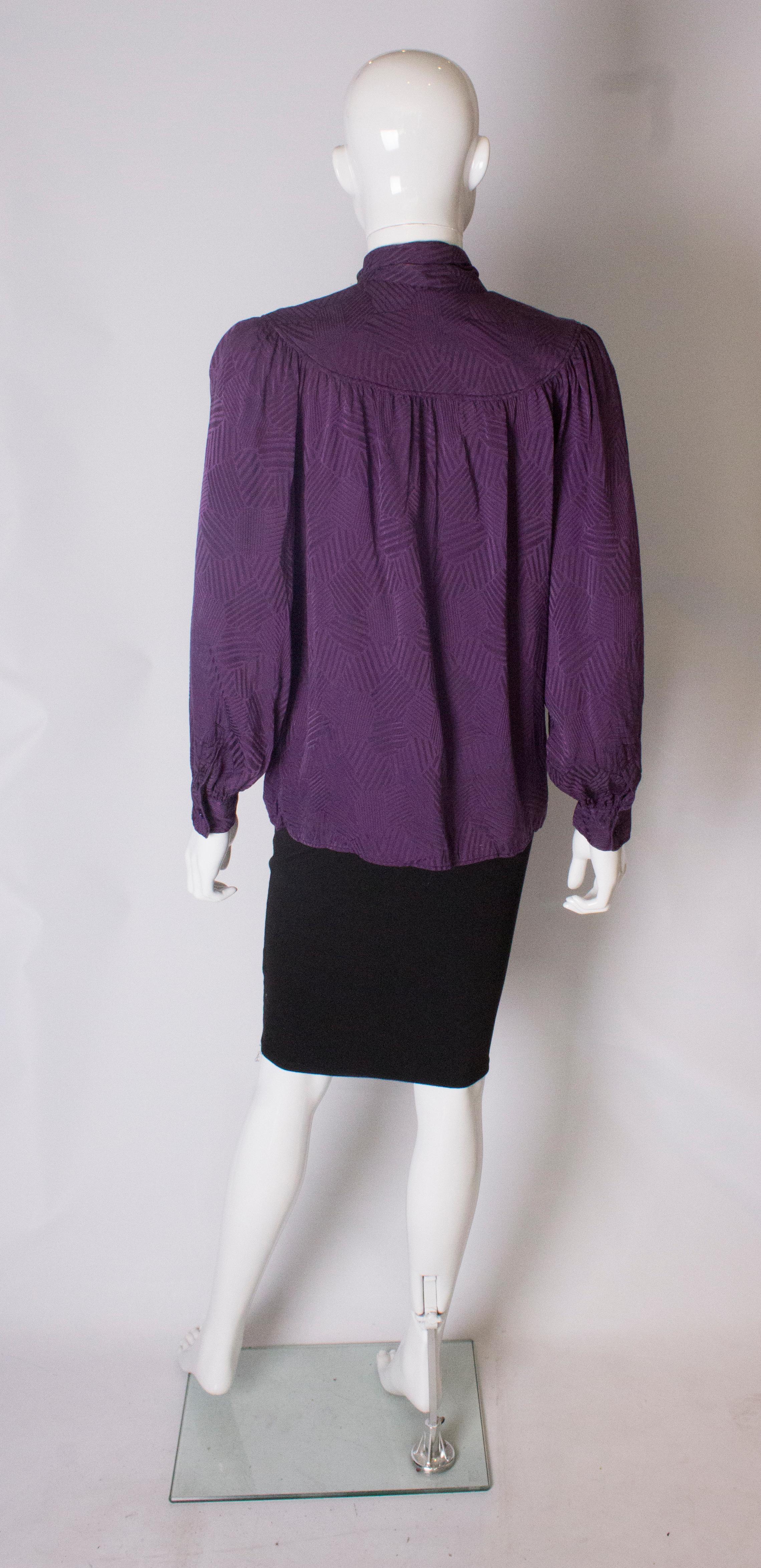 Women's A Vintage 1970s silk purple pussy bow blouse by Yves Saint Laurent 