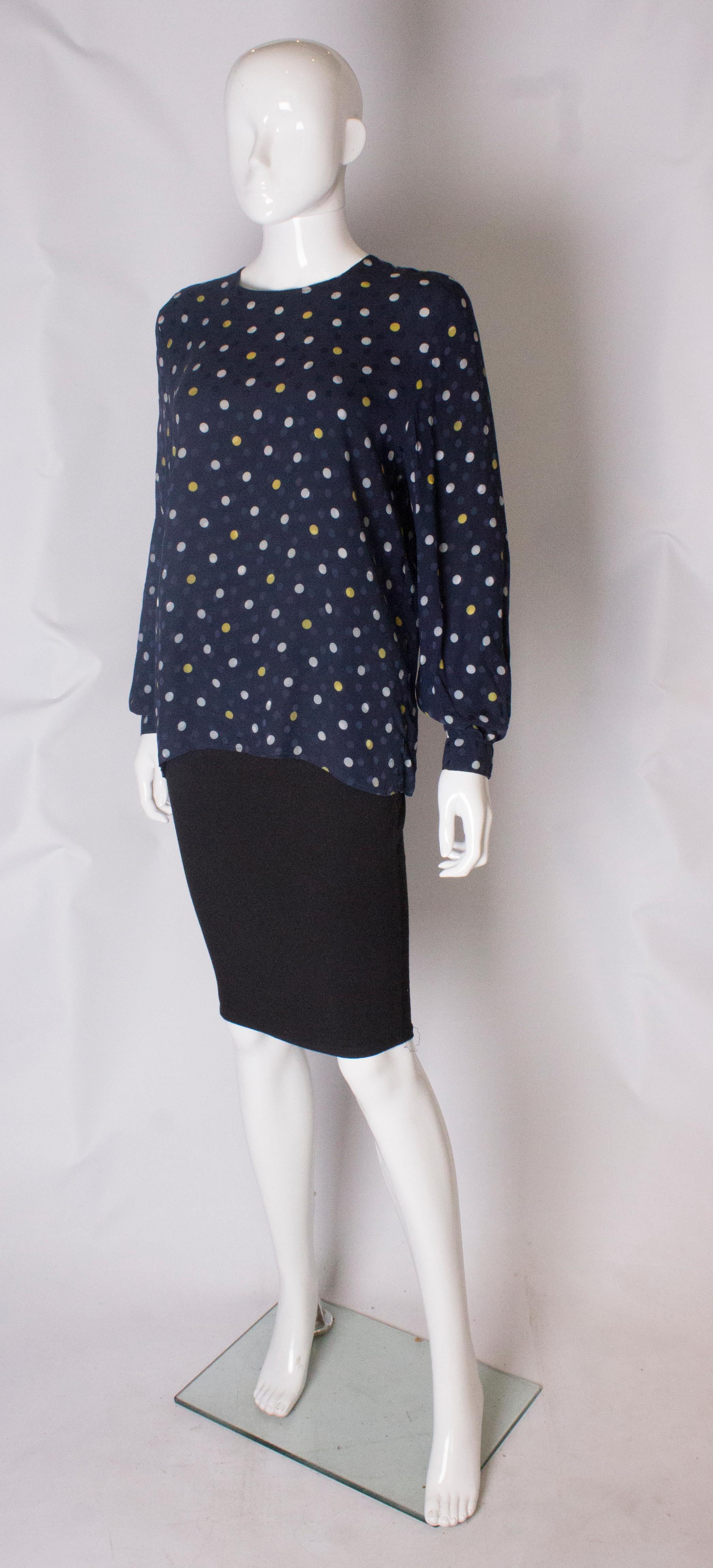 Black A Vintage 1990s navy polka dot silk blouse by Valentino  For Sale
