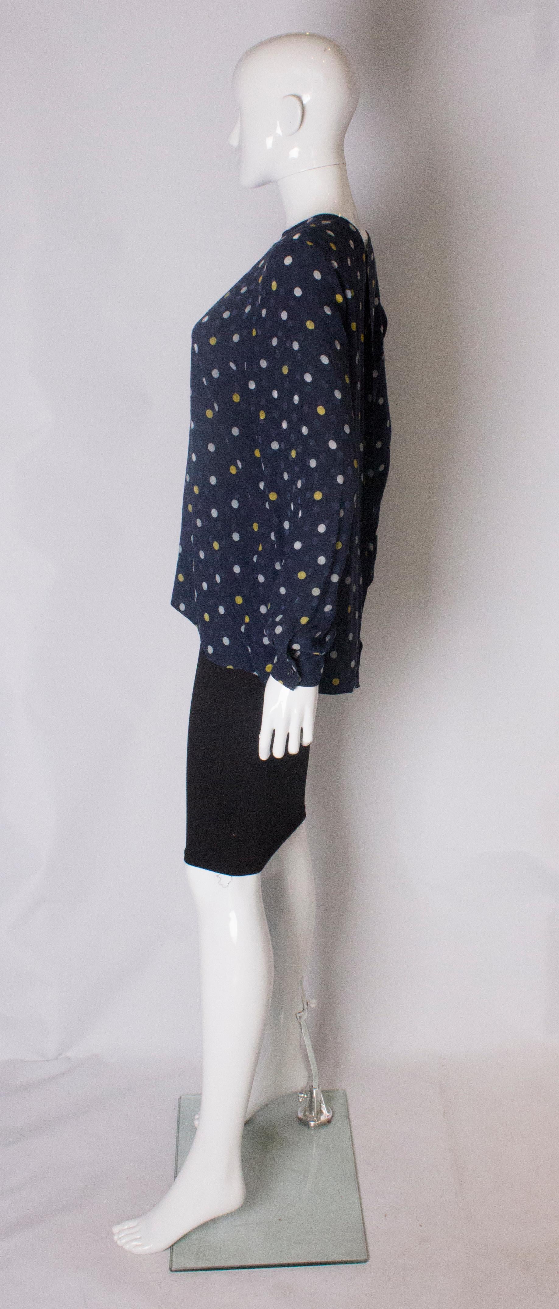 Women's A Vintage 1990s navy polka dot silk blouse by Valentino For Sale