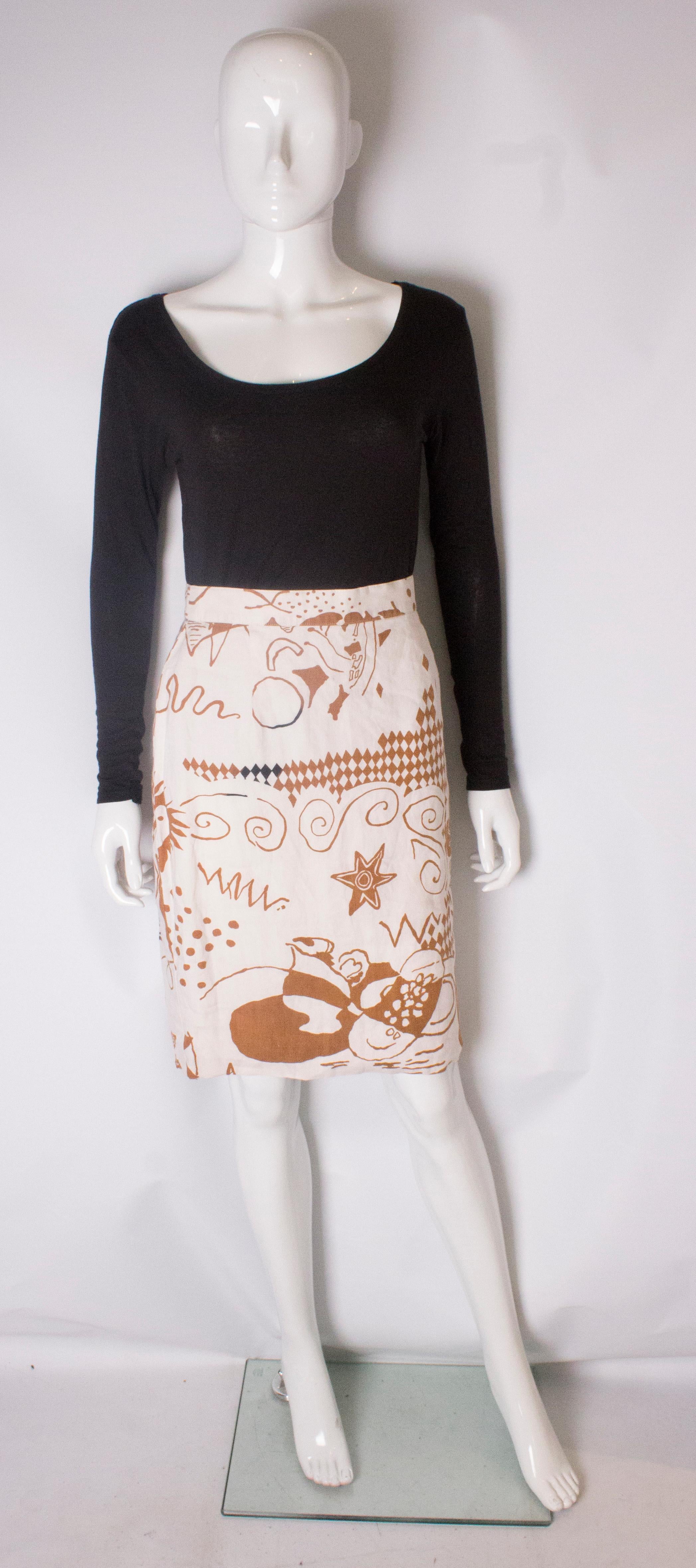 A chic vintage skirt by Louis Feraud. The linen skirt has a  white background and a  print in shades of brown and black. The skirt has a central back zip and is fully lined , and has a 2'' hem.