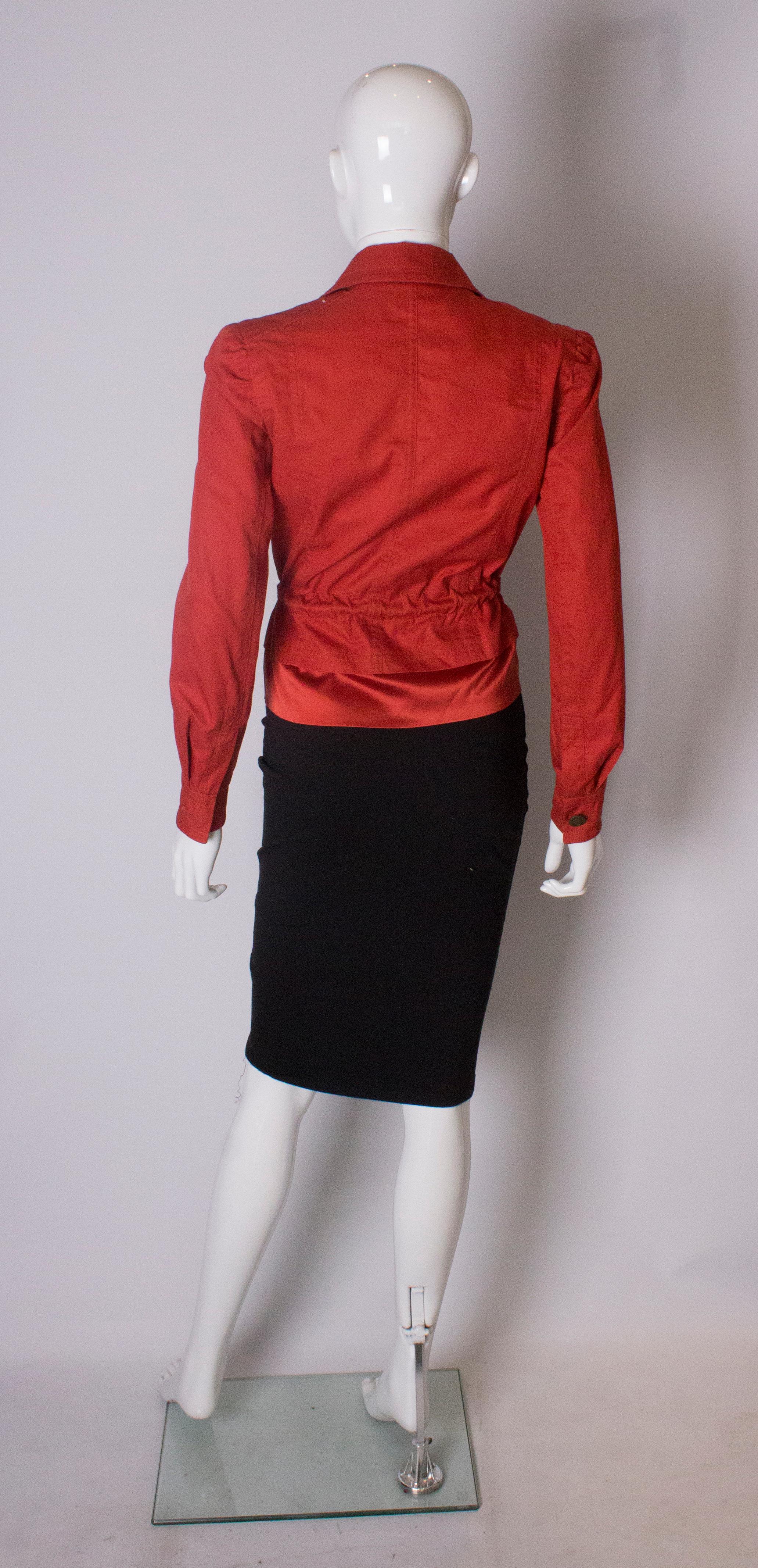 A Vintage 2000 red belted jacket by Yves Saint Laurent  2