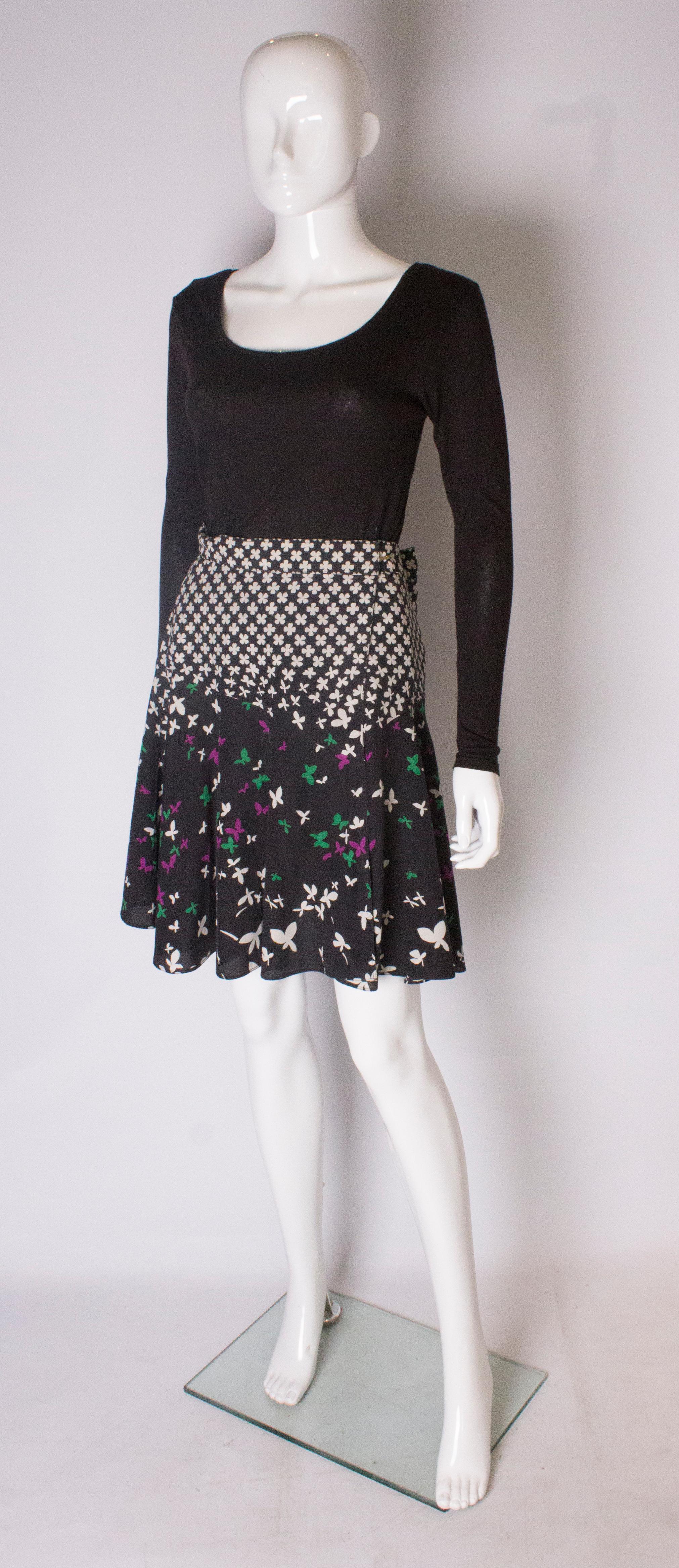 Black A vintage silk printed wrap over mini skirt by Yves Saint Laurent