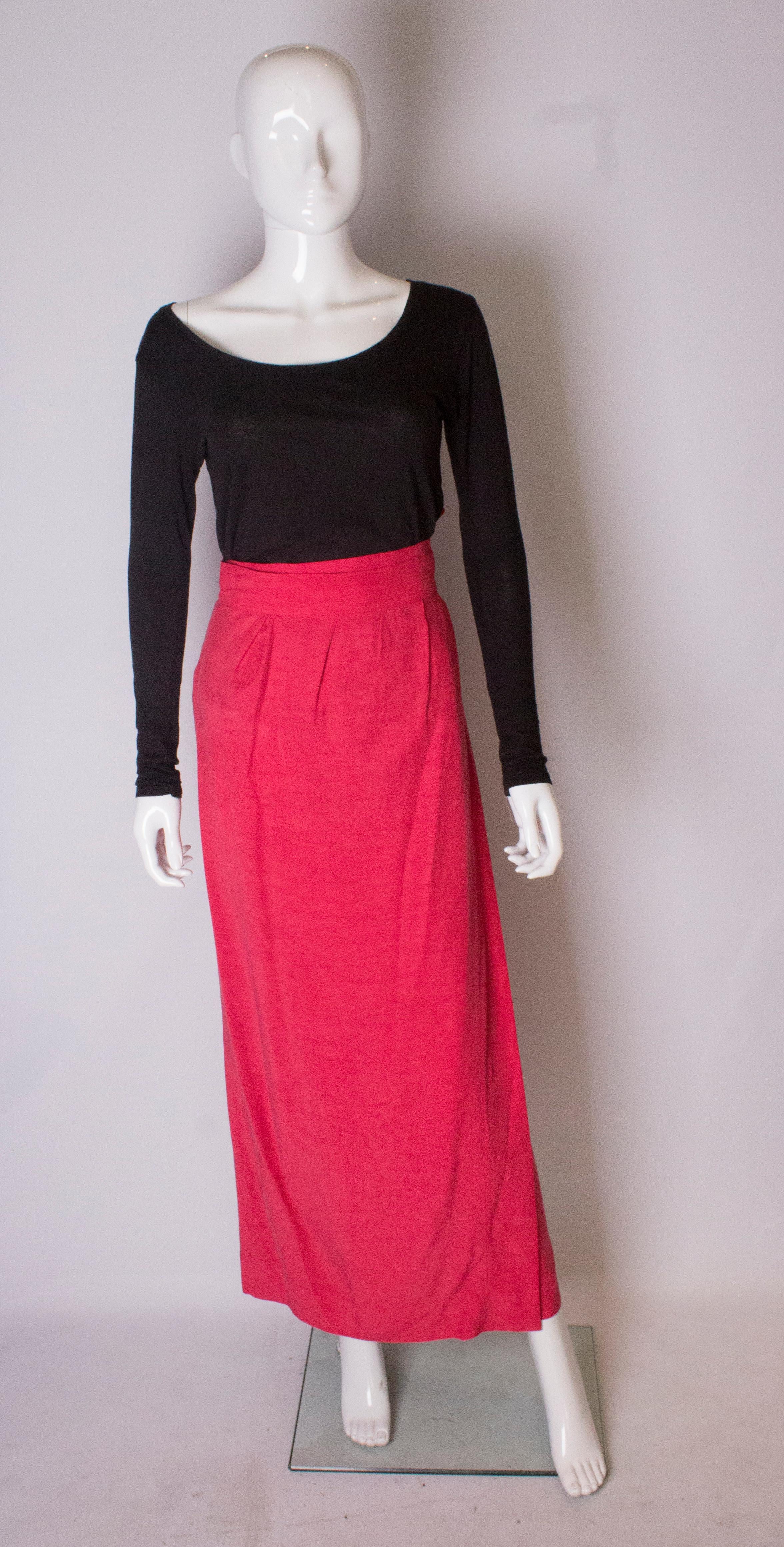 A pretty skirt by Yves Saint Laurent Rive Gauche. The skirt is a wrap over style with ties, and slight gathering at the waist.