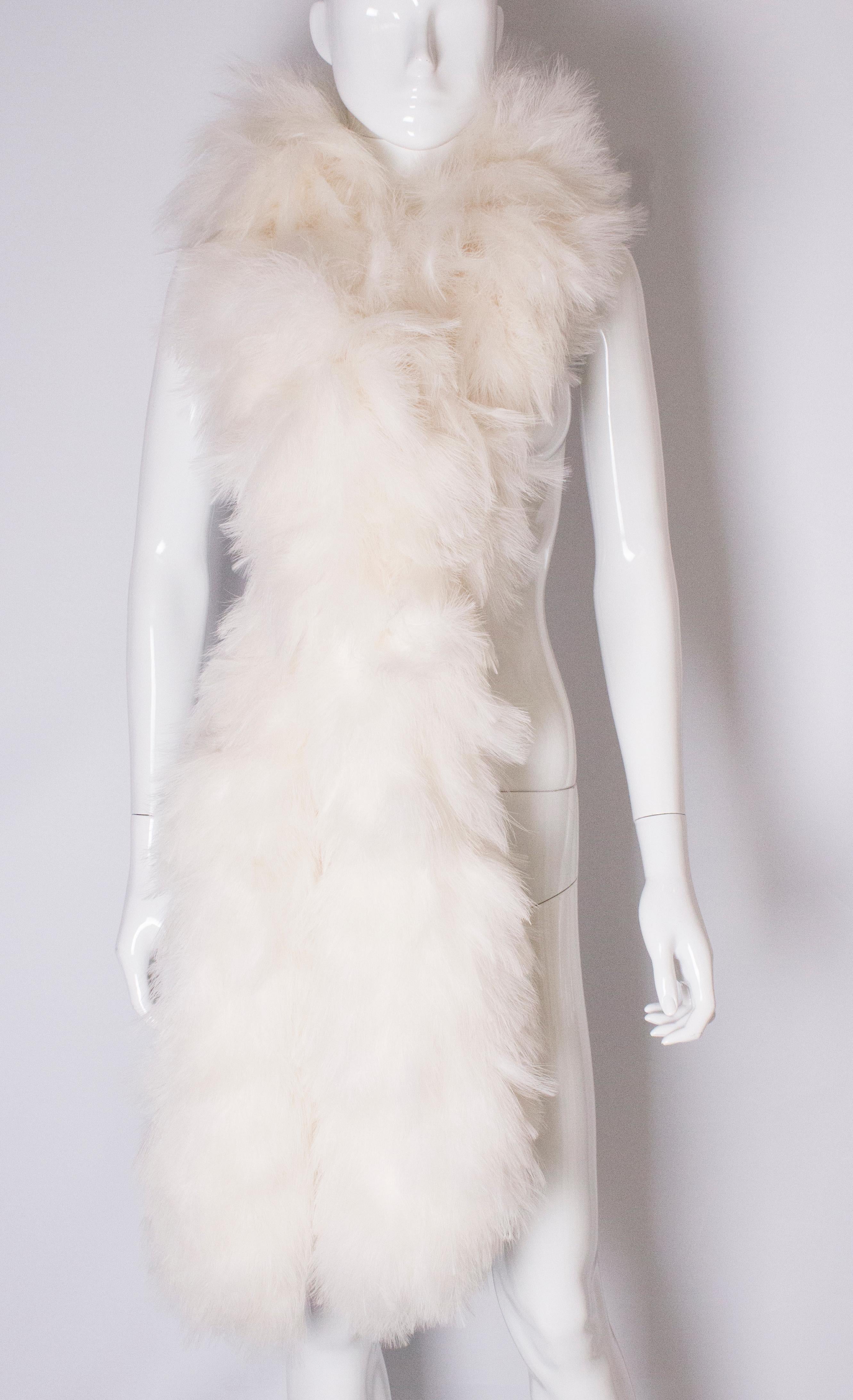 A super stylish ostrich feather boa. This boa is wonderfully fluffy and full, and very white  . It measures 78'' in length.