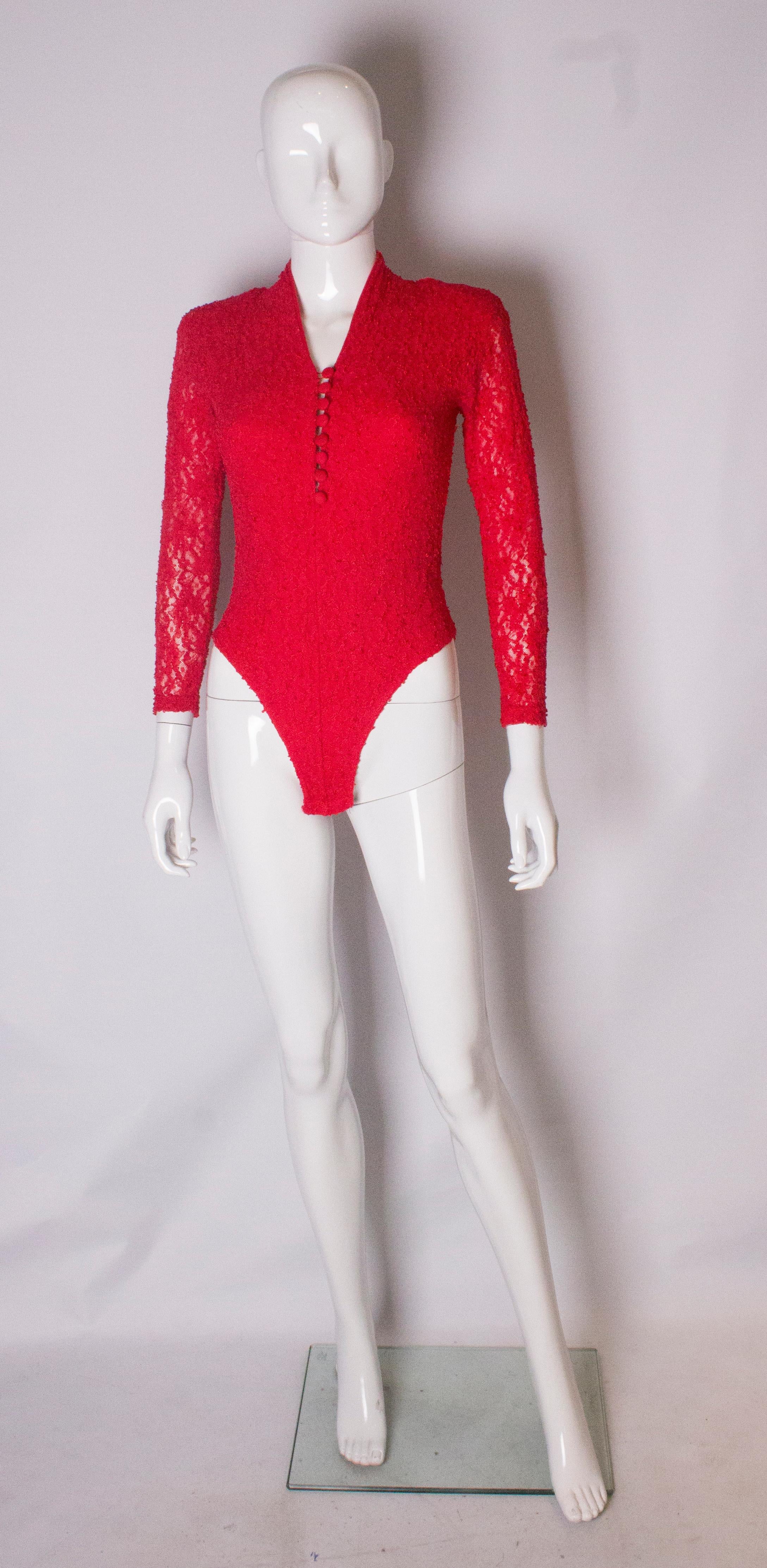 A great lace body from the 1980s.  This body has a v neck front with button opening, and elbow length sleeves. It is lined at the front but not at the back, and the popper fastenings are secure.