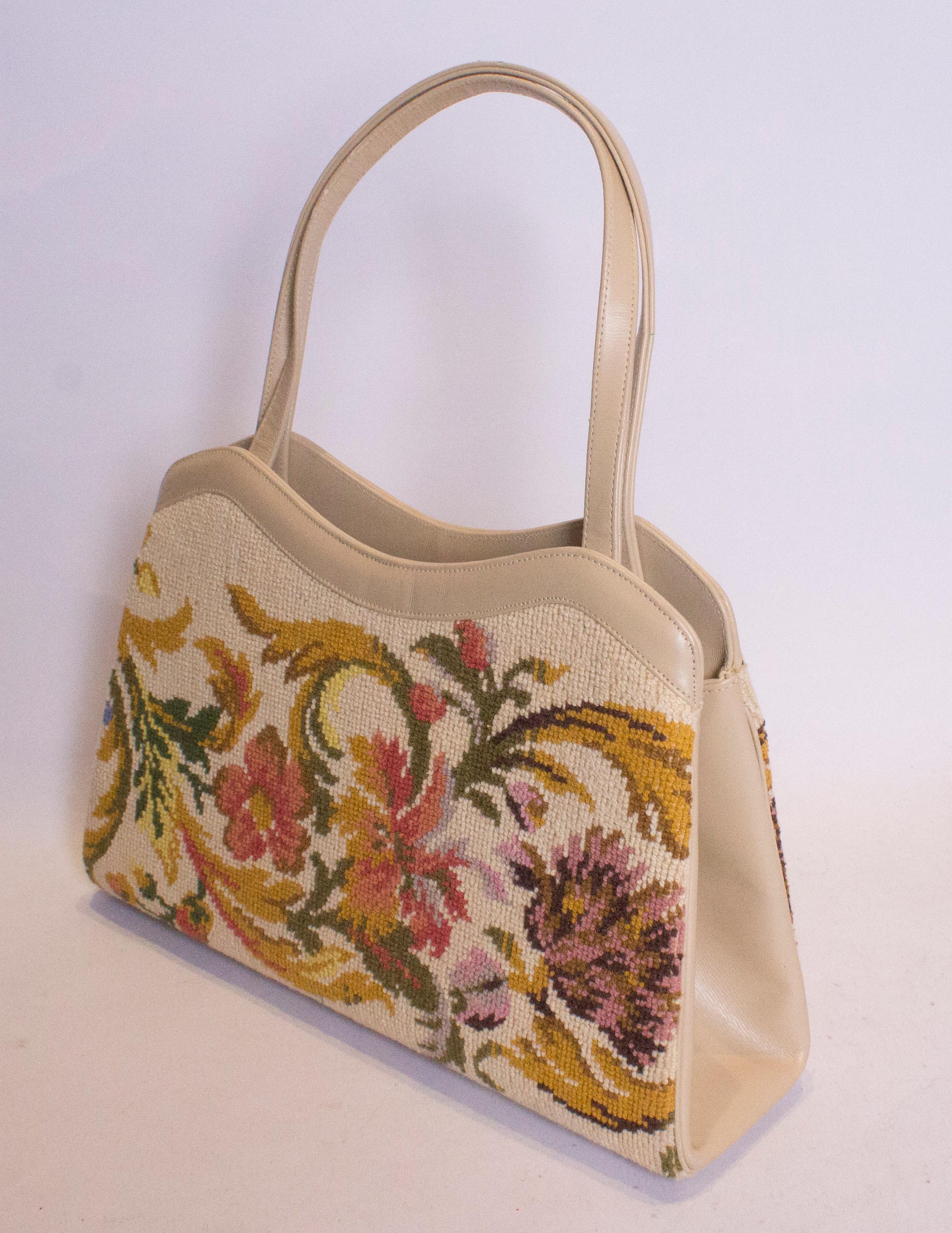 A pretty bag for Fall. The bag is a useful size, with a pretty scalloped top. Internally there is one zip compartment
Measurements:  width 13'', height 8'', depth 3 1/2''