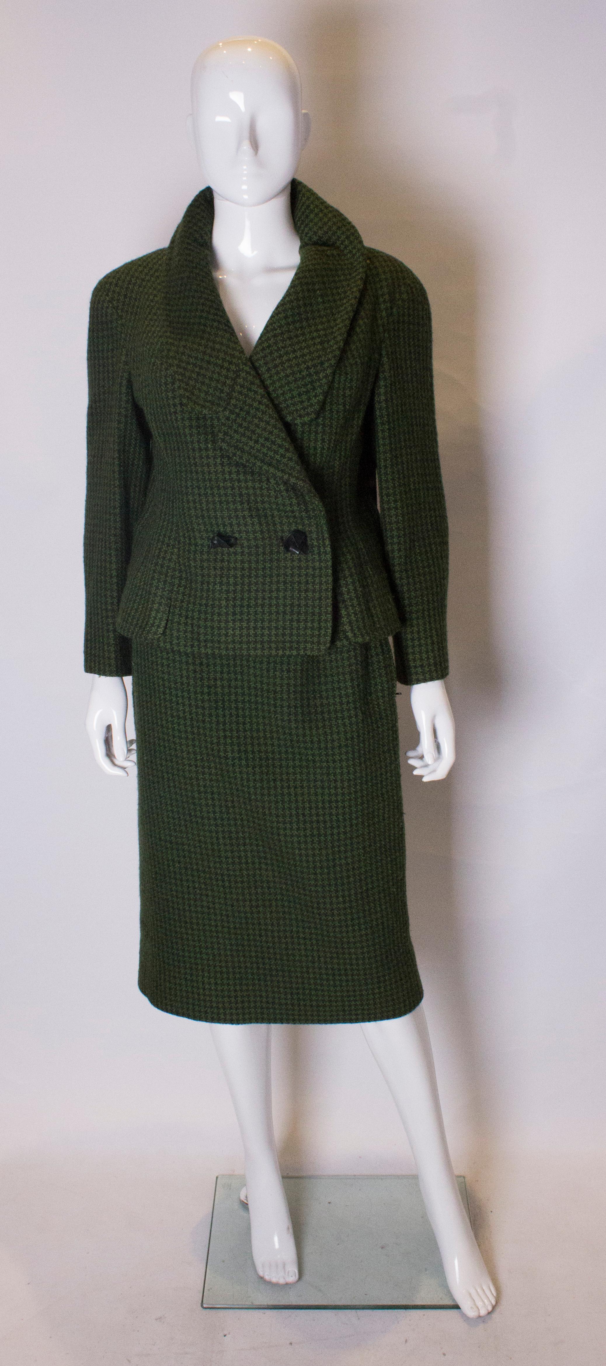 A charming vintage suit by Hardy Amies, ready to wear line. The jacket has an attractive cut away collar and fastens with leather ties,n the skirt has a side zip and is fully lined.
Jacket : bust 38'', length 21'', skirt waist 27'', length 28''