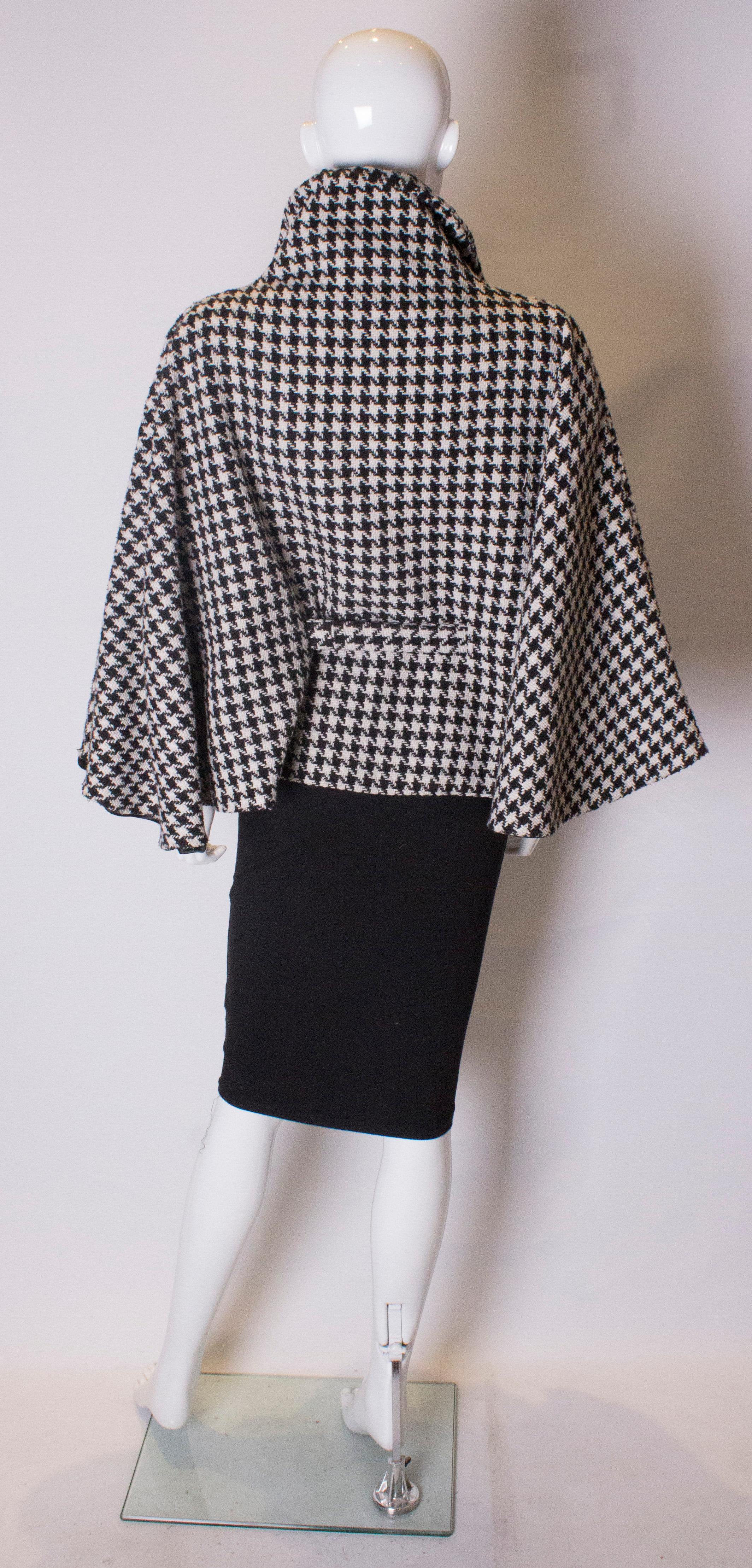 A Vintage 1970s Dents Black and White houndstooth Cape 1