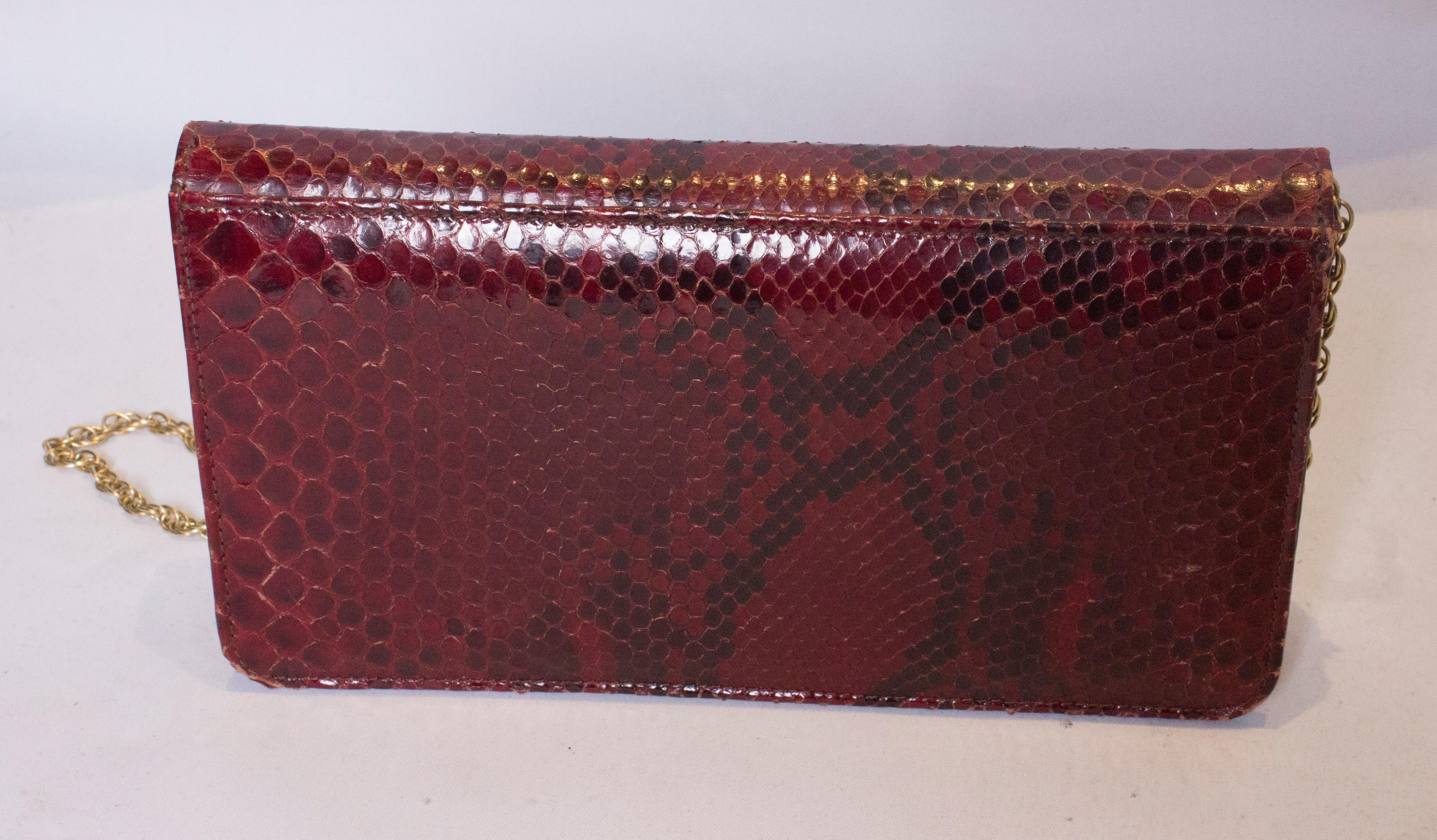 red snakeskin bag