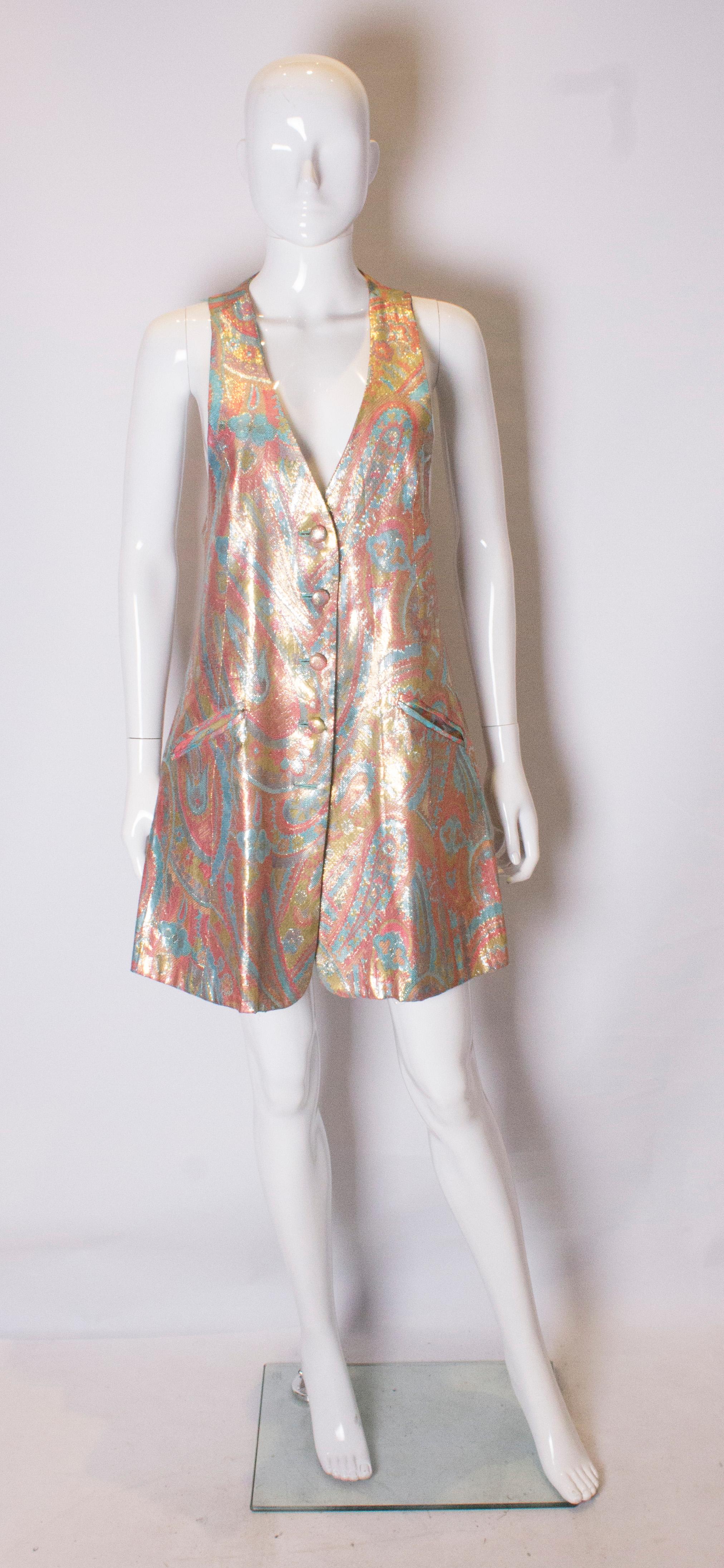 A great mini dress for the festive season. The dress is button through with five buttons and has two pockets, and is in a wonderful mix of colours. It is fully lined.