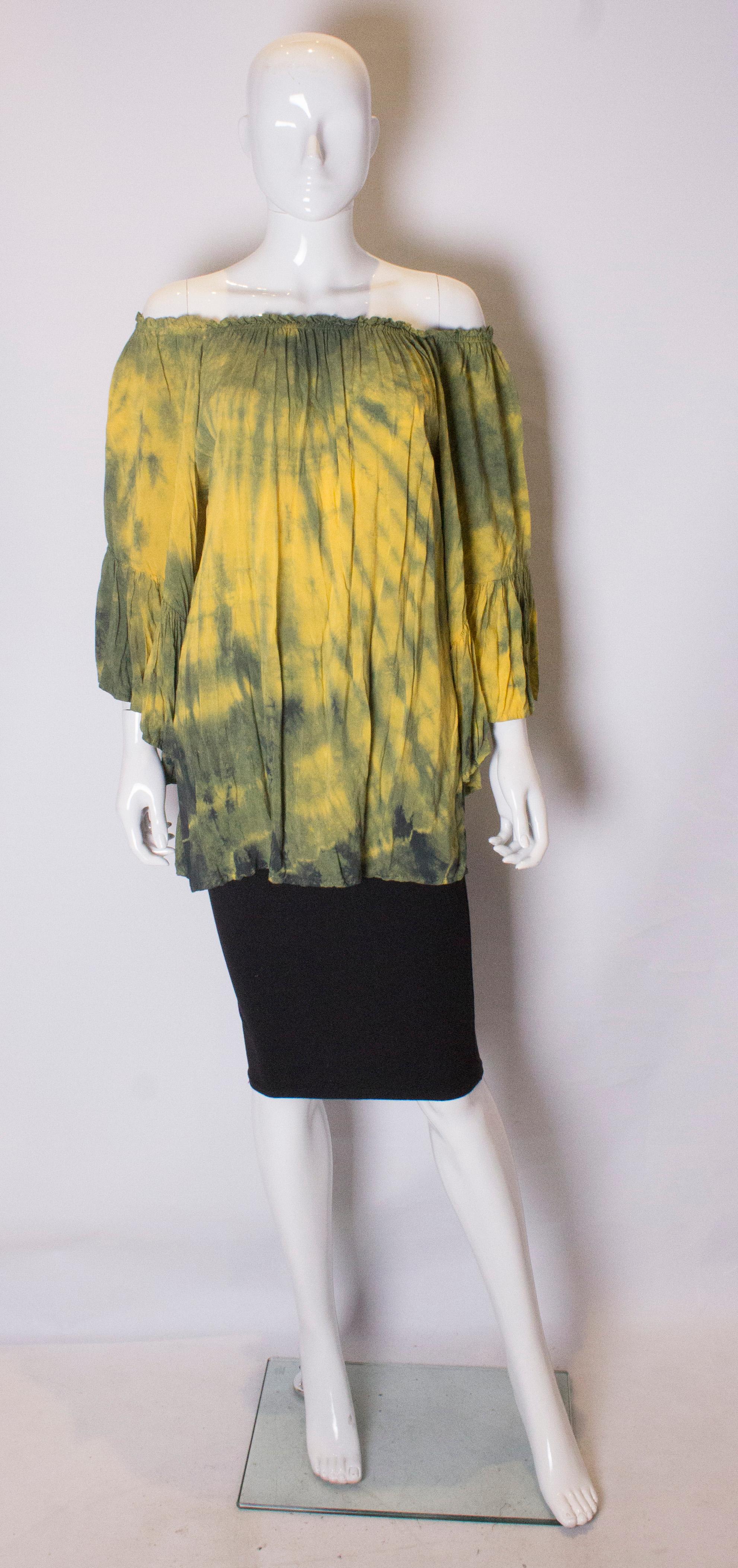 A fun vintage top , in a yellow and green mix.  The top has an elasticated neckline and so can be worn on or off the shoulder,and has elbow length sleaves.