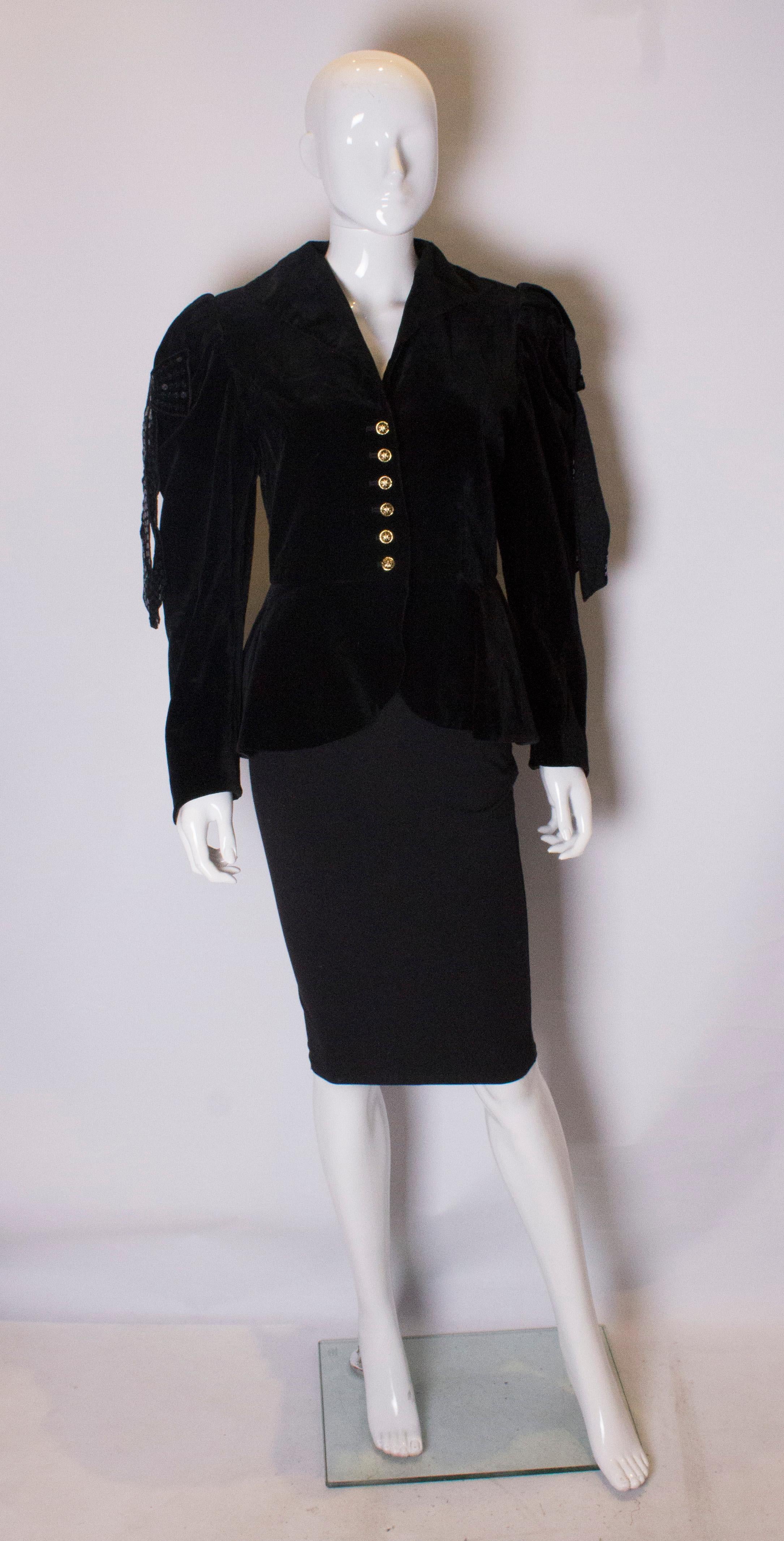 A great jacket for the party season by Helen Strasser.  The jacket is wonderfuly tailored , and has a six button front opening. It has a cut out front and sequin bows on the shoulders and back. The jacket is fully lined.