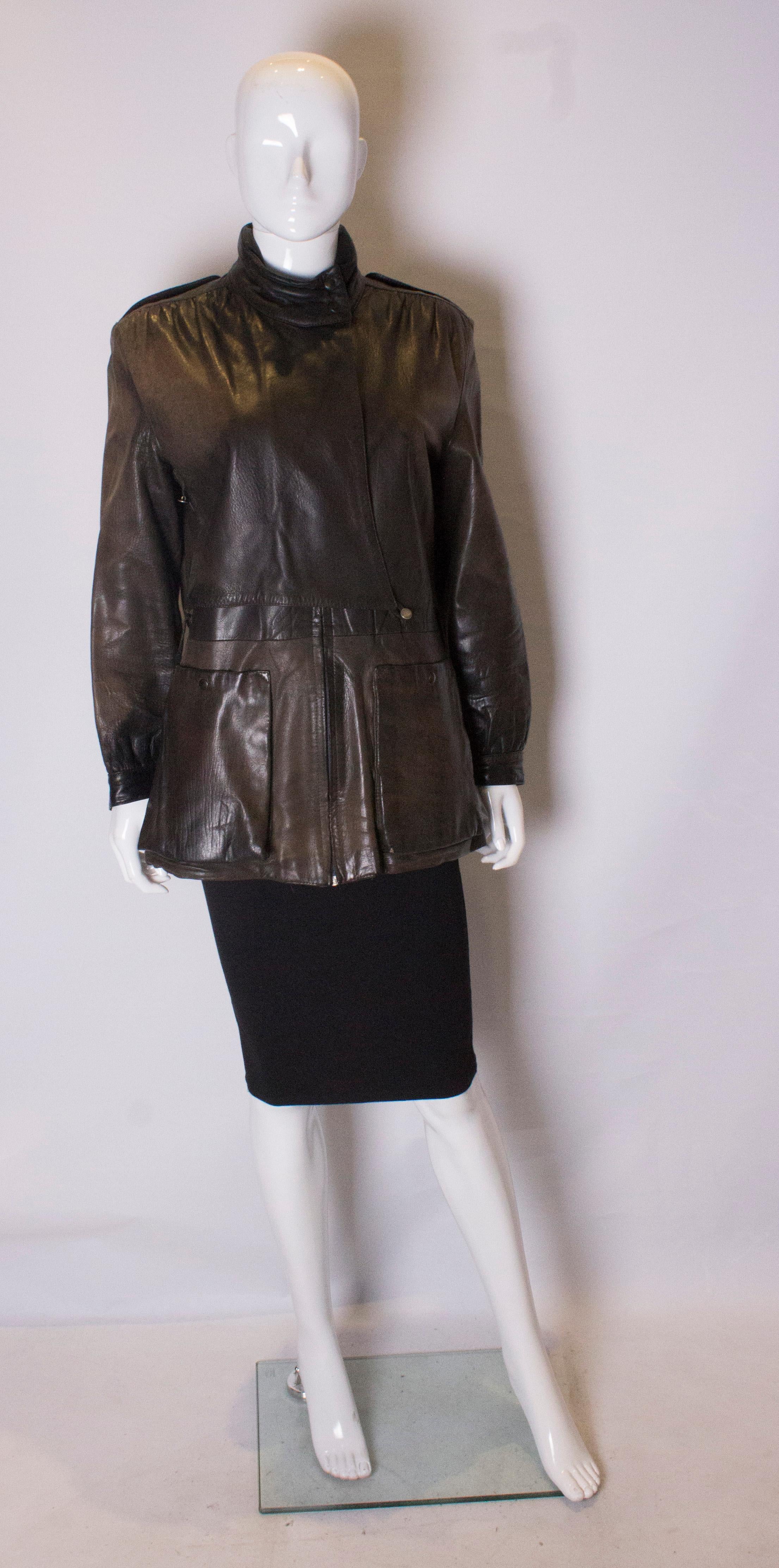 A well loved vintage  leather jacket  The jacket has two external pockets, a zip opening , stand up collar  and is fully lined.
