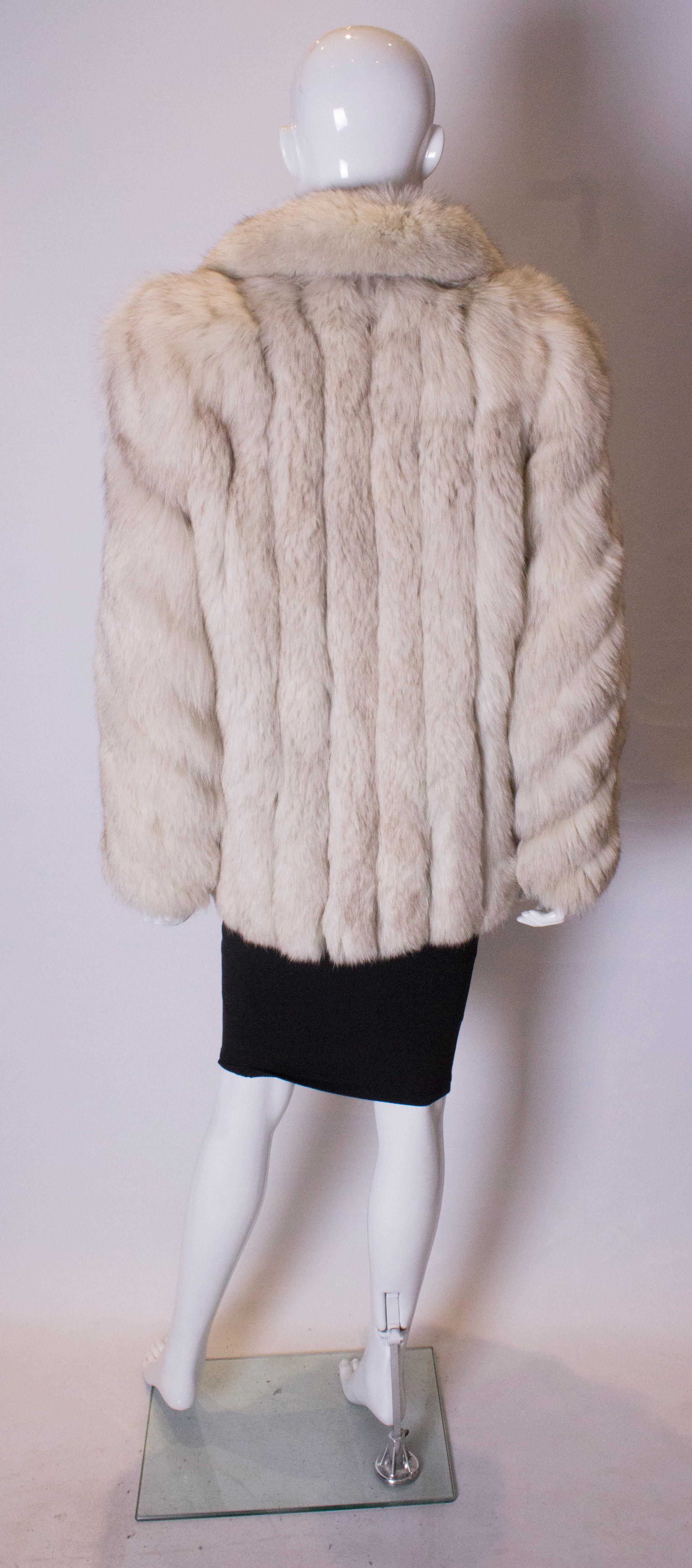 A vintage 1970s artic white fox fur jacket winter coat 1