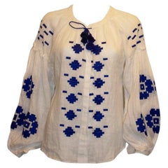 Stunningwhite blouse with blue embroidery by March 11