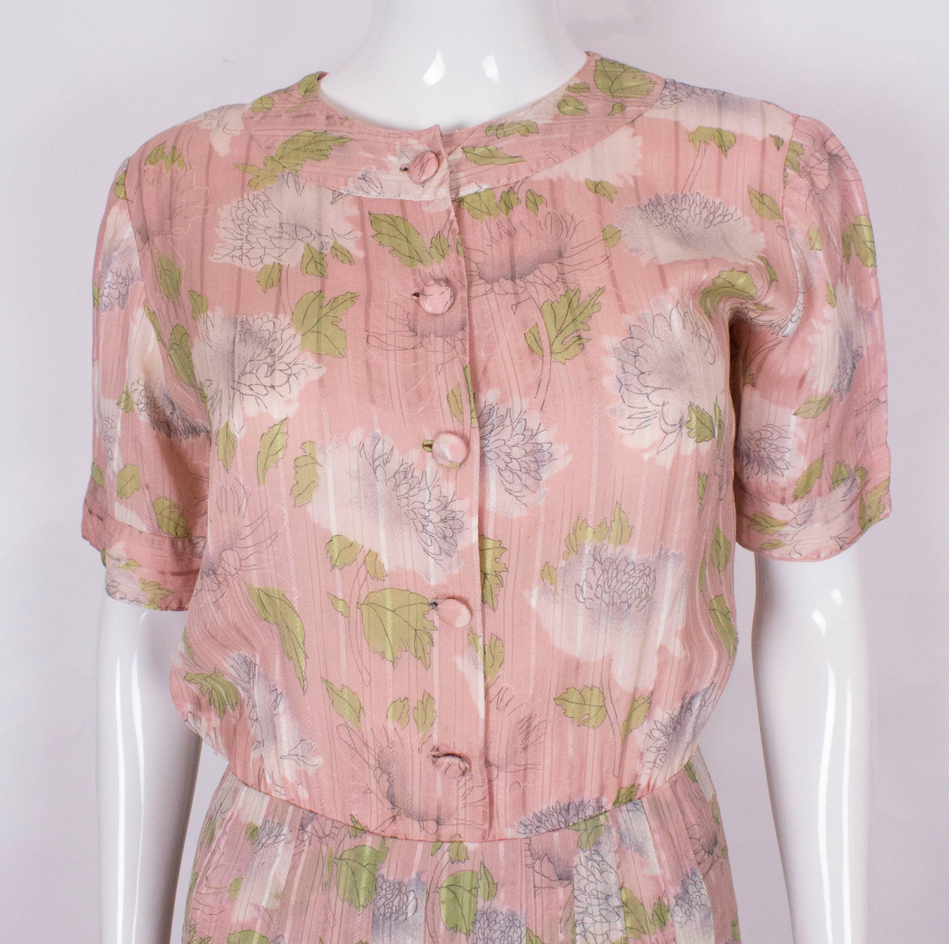Women's A vintage 1940s floral print, pink summer cotton day dress