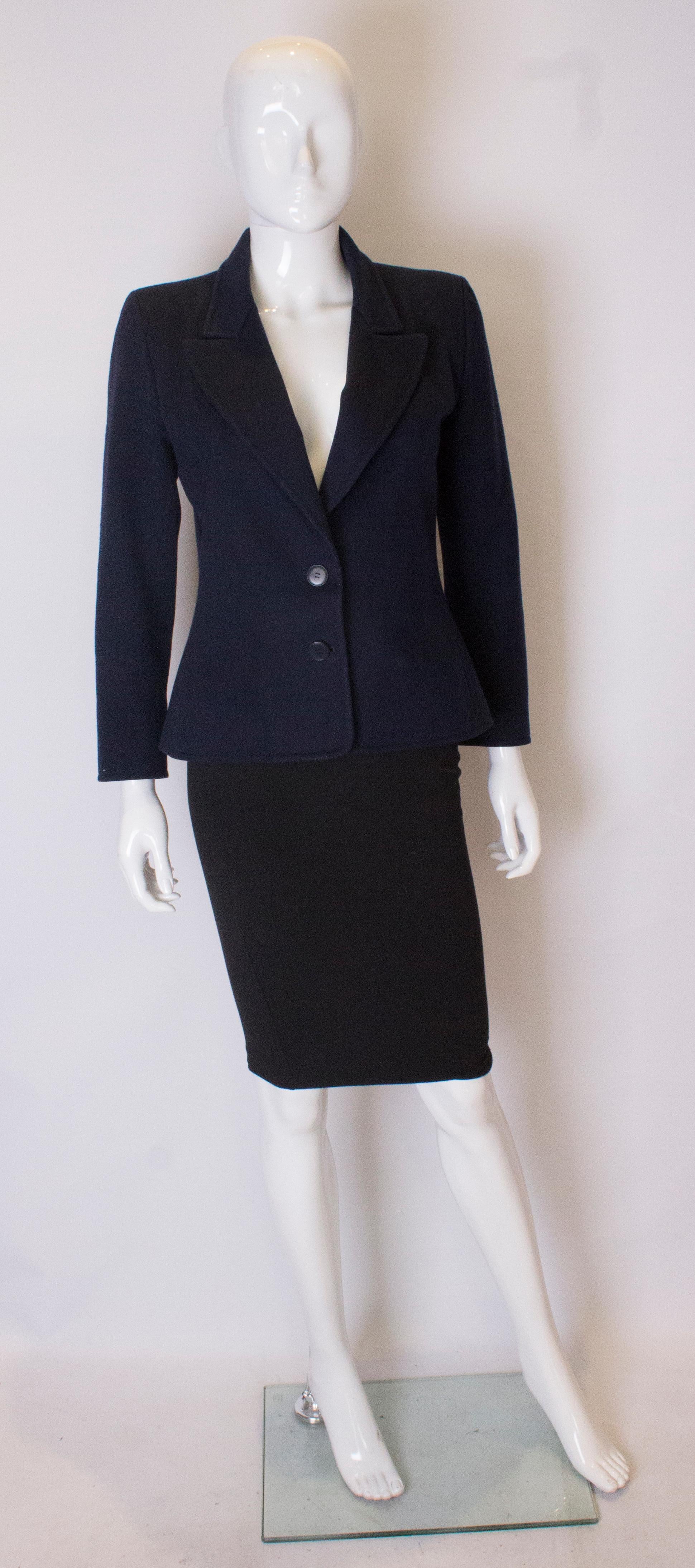 A chic numbered jacket from Yves Saint Laurant. The jacket is in blue wool, with a two button opening at the front and is fully lined. Jacket number 48874.