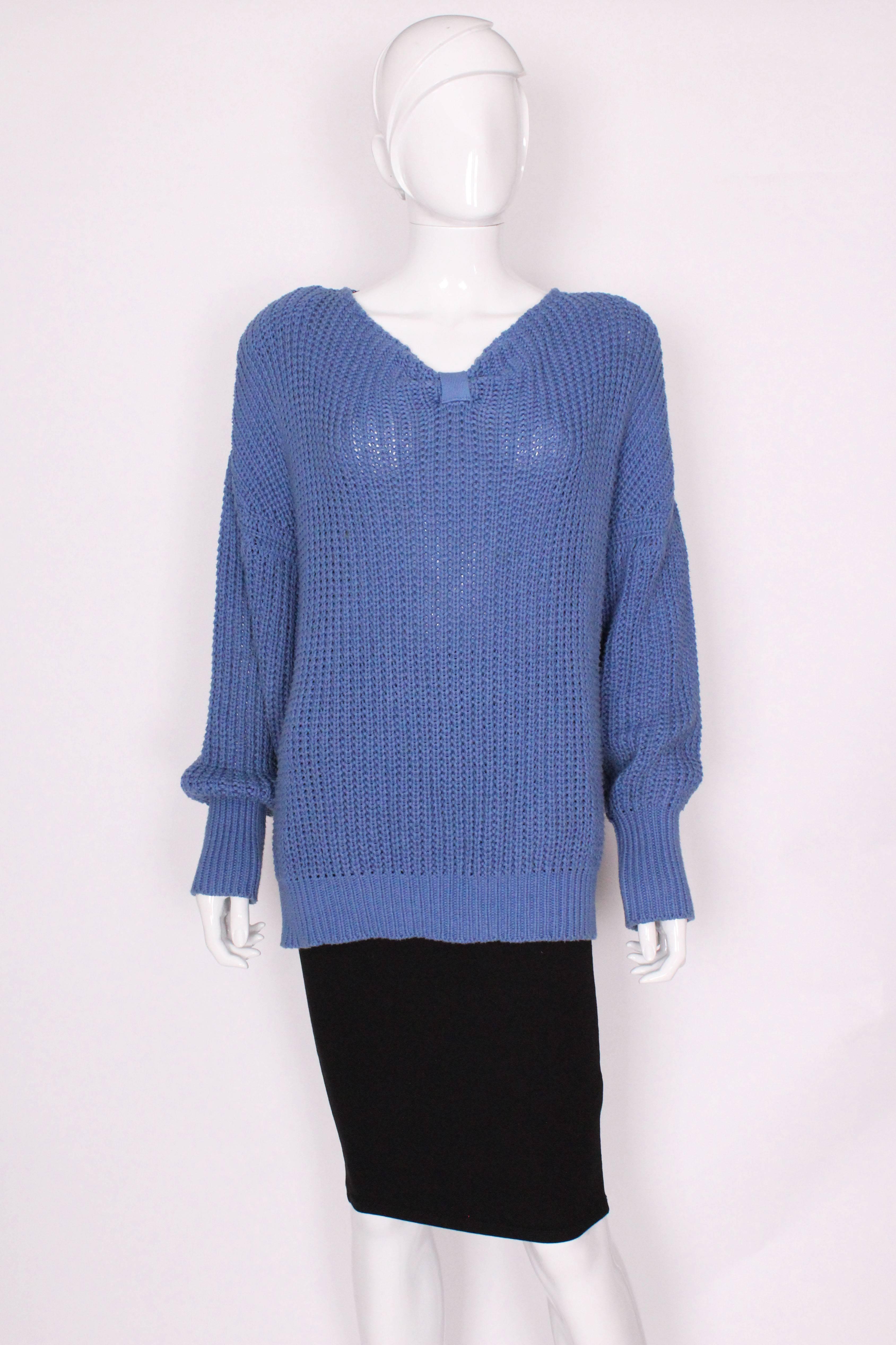 
A great casual jumper for the last days of Summer. In an easy to wear heavy weight cotton, this jumper has all the style and quality you would expect from Jean Muir. The jumper is a pretty cornflower blue colour, with a v neck and  3'' of narrow
