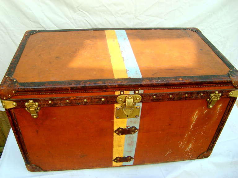 Fantastic Louis Vuitton Orange Vuittonite canvas steamer trunk circa 1903.  The orange vuittonite is one of the rarer canvases to see on a large trunk.  This one is in very nice shape and would make a perfect coffee table.  size is 40 x 22 x 23.