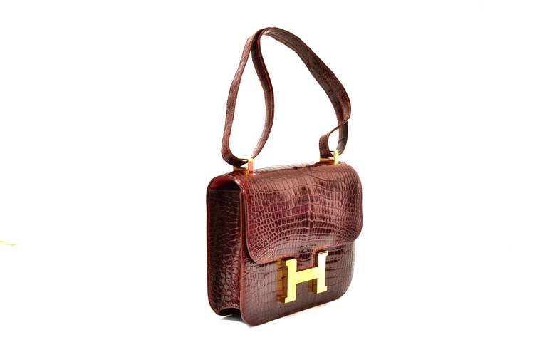 Brand: Hermes

Style: Constance

Size: 22cm

Leather: Burgundy Crocodile

Hardware: Gold

Age: Vintage

Condition: Very Good