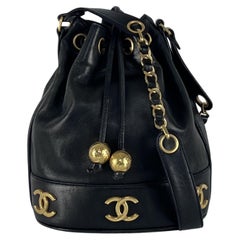 CHANEL Drawstring Bucket Bag Black Lambskin 1990s Collection CHANEL Drawstring Bucket Bag Black Lambskin 1990s Collection