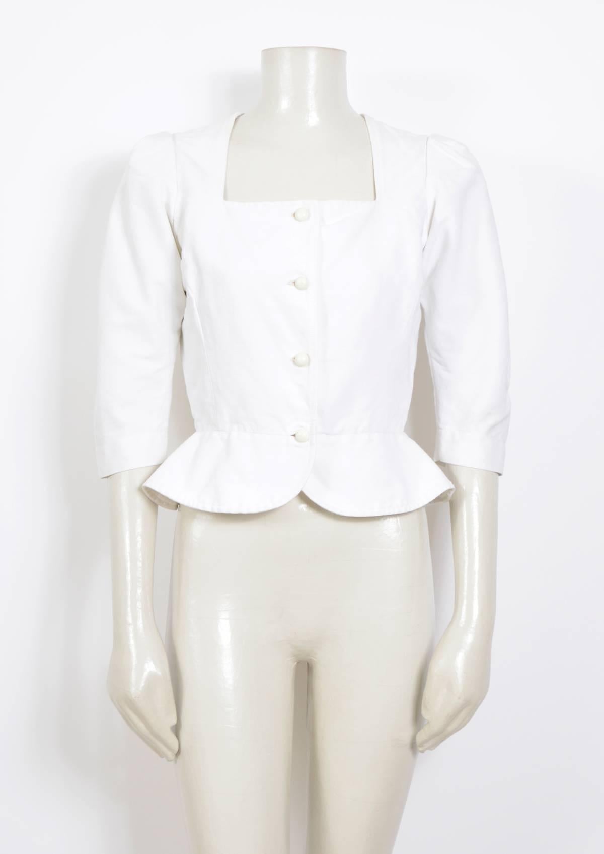 Vintage Yves Saint Laurent white fitted heavy cotton peasant top.
There is some interesting shoulder sleeve work on this jacket.
In excellent condition. 
Please go by measurements taken flat: Ua to Ua 18inch/46cm(x2) - Waist 13inch/33cm(X2) - Total