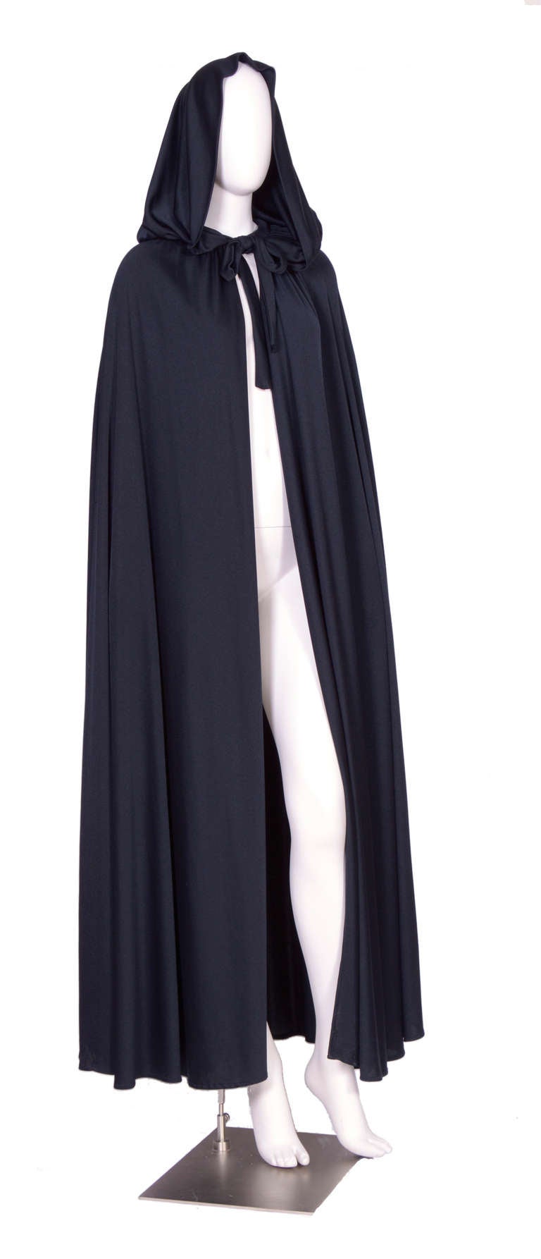 Vintage black cape by Loris Azzaro made in a poly jersey. 
The total length is 60inch. Excellent condition