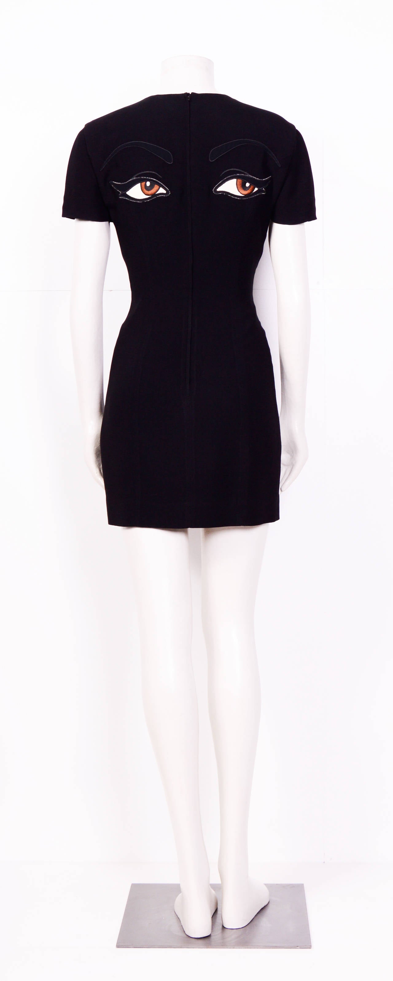 Sexy, iconic Moschino Couture black dress with embroidered eye embellishment. 
In excellent condition.
Size EU 38, UK 10 ,US 6