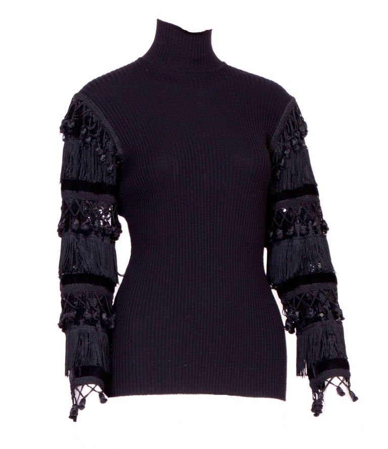 Fantastic sweater by Jean Paul Gaultier, sleeves embellished with tassels, fringes, velvet ribbons & sequins. In excellent condition.