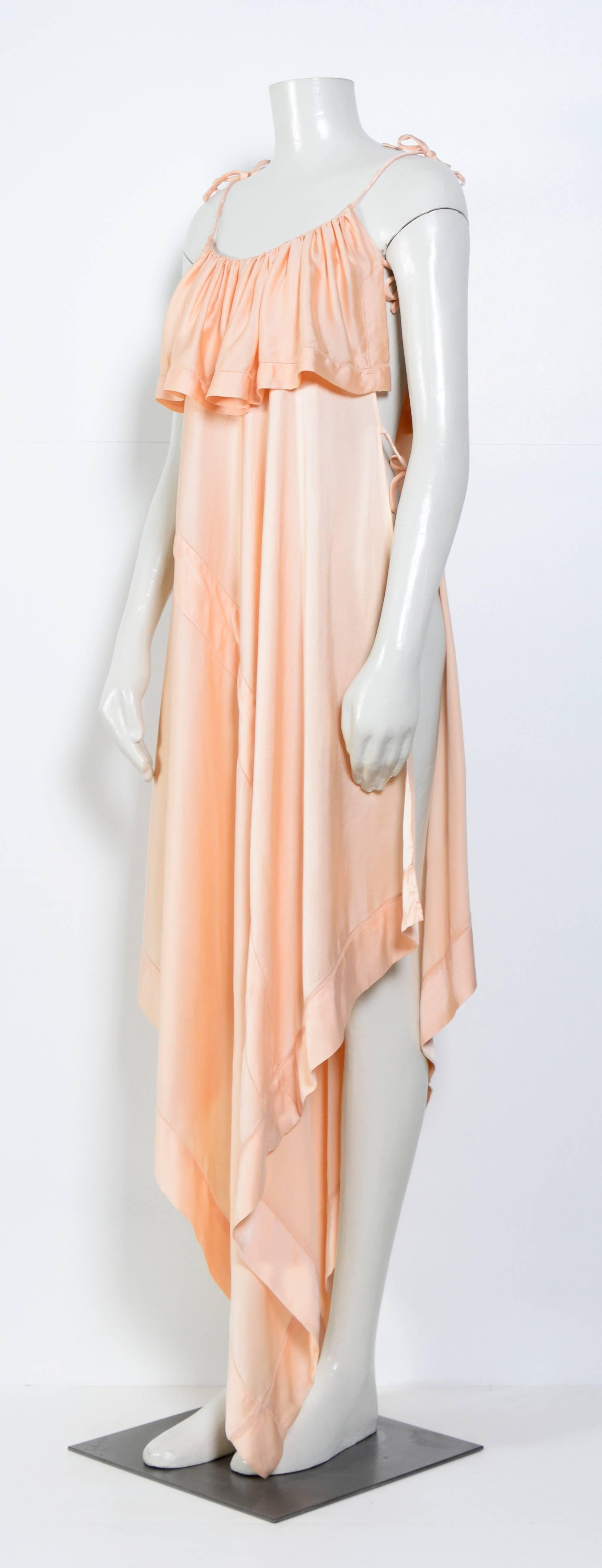 Vintage soft pink silk dress by Angelo Tarlazzi
2 panels attached with strings, open on the side.
Measurements Free
