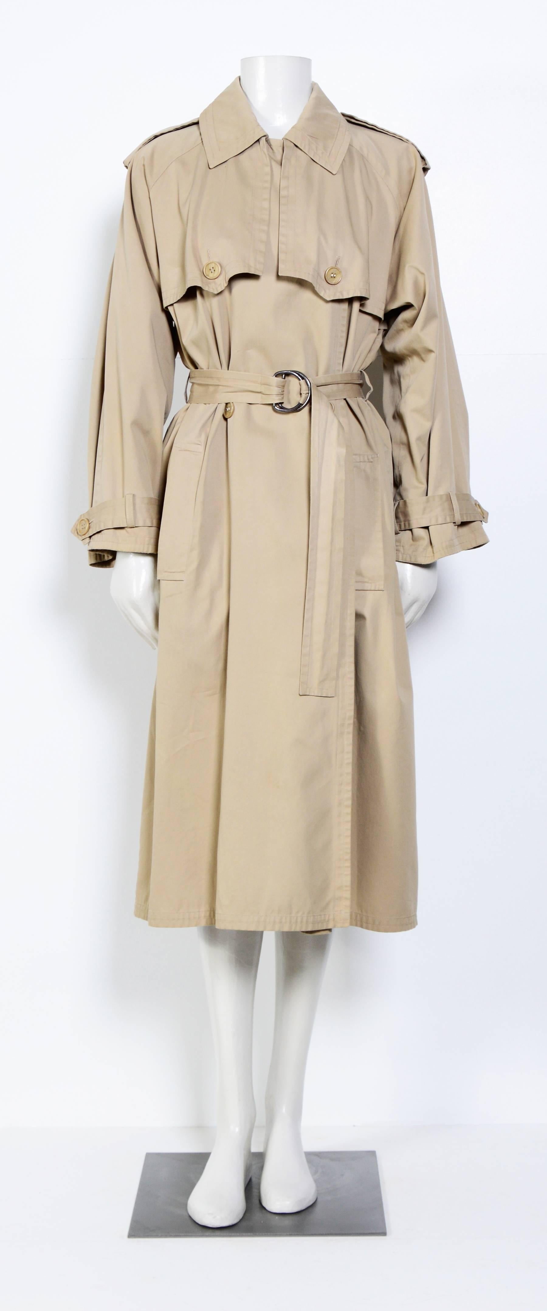 Classic Saint Laurent trenchcoat circa 1960's.
Please go by measurements taken flat in inches: Ua to Ua 22,5