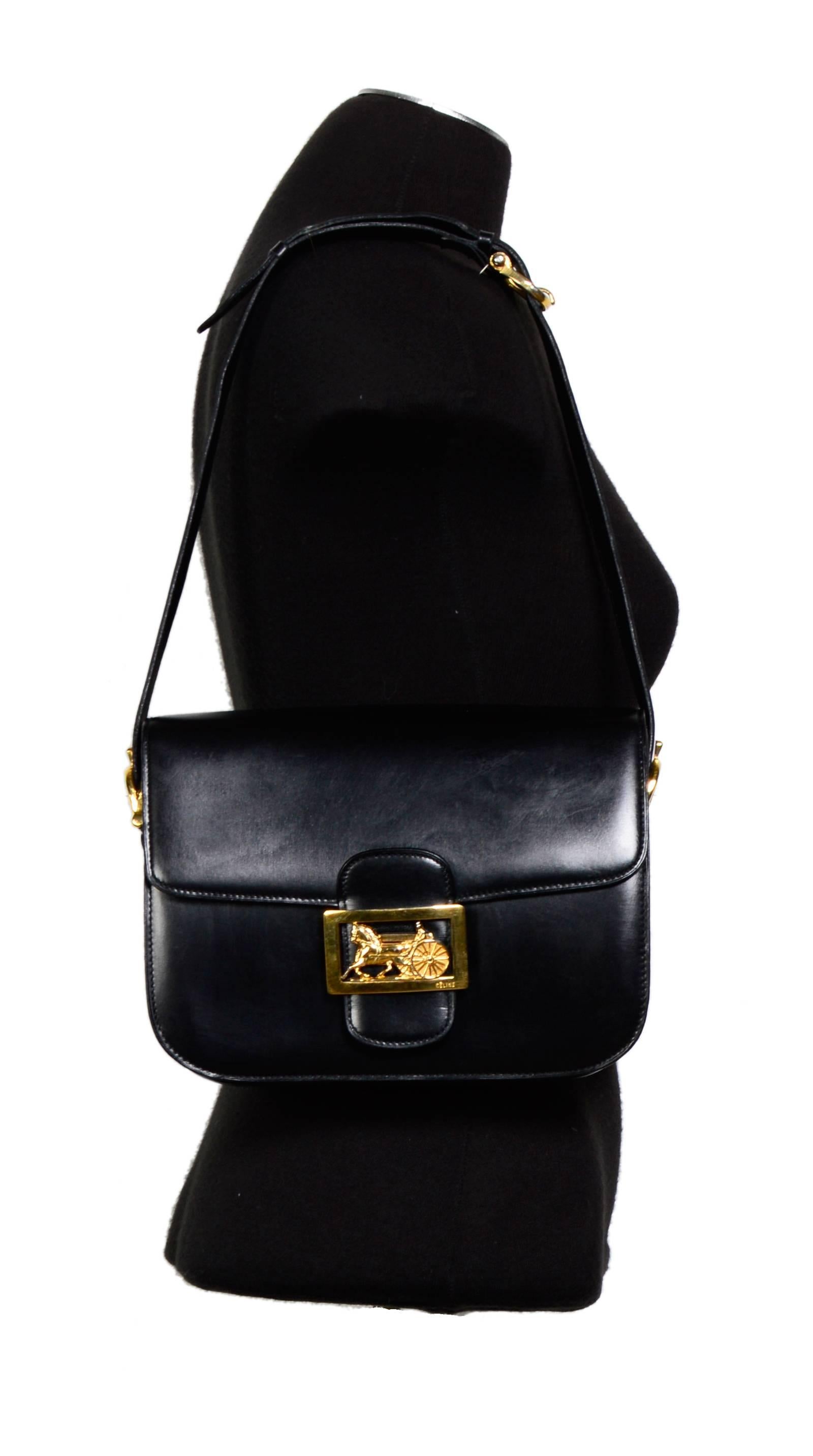 Sublime condition! Hardly ever used! 
Celine 1970's  Horse Carriage Buckle Black Box Leather Shoulder Bag

Three compartments. Three pockets + one zippered pocket.  Adjustable shoulder strap.  

Marked CELINE Paris Made in Italy. 

CONDITION