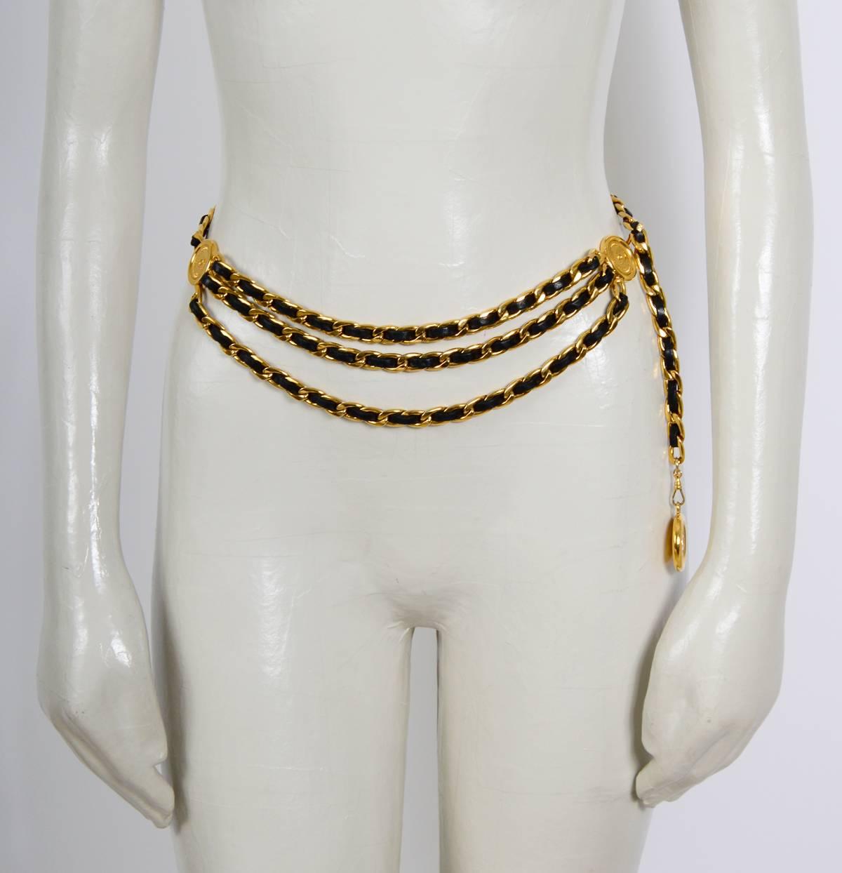 This vintage signed Chanel piece features leather stripping entwined in a gold-tone link chain with faux Chanel coil accents. Wear it as a worn as belt or necklace. Measurements Length 33inch/84cm Each faux coin states “Chanel 31 Rue Cambon Paris”