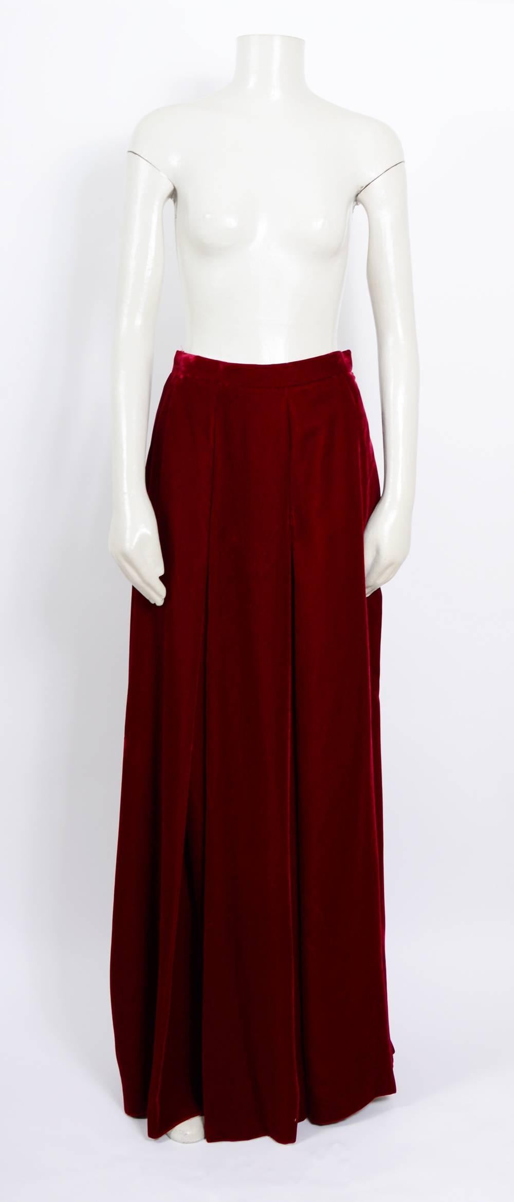 Stunning!!! Ruby red soft velvet pleated Long Yves Saint Laurent 70's Boho Full Swing Skirt.
Unworn with tags still attached.
French Size 38 
Measurements taken flat: Waist 14inch/36cm - Hips free - Total length  44inch/112cm  
