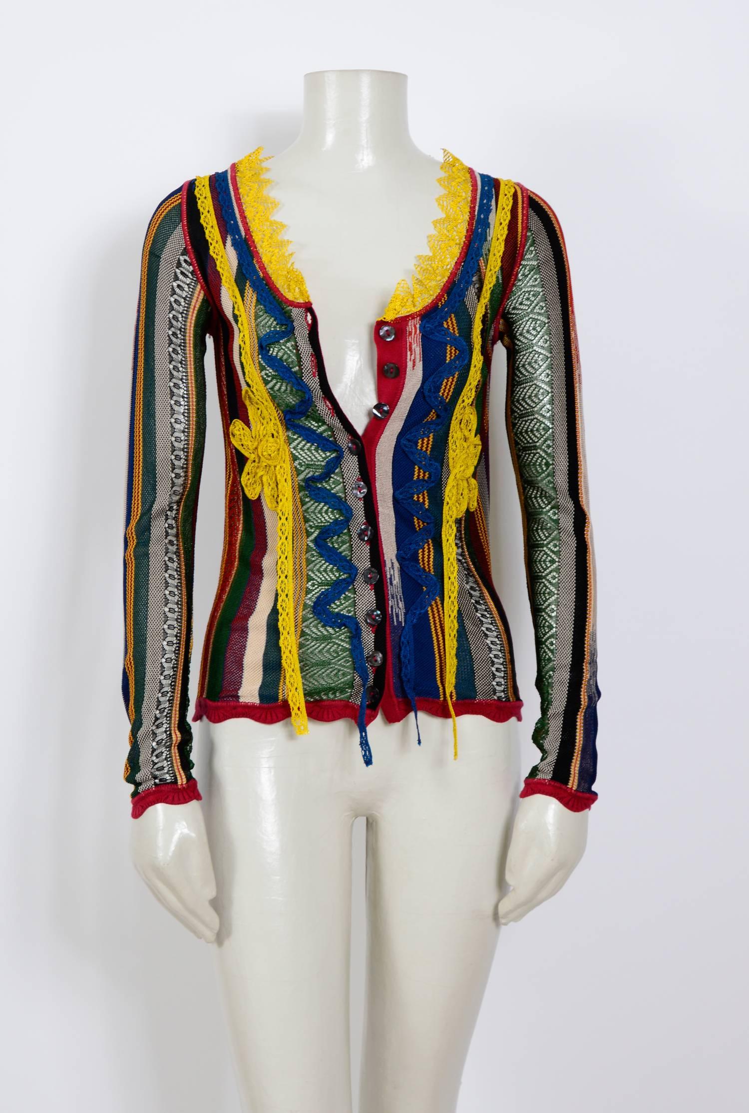 Vintage Jean Paul Gaultier knitwear at his best is this beautiful cardigan.
Measurements taken flat: Bust 14,5inch/37cm(x2) - Waist 14inch/36cm(x2) - Sleeve 25inch/64cm - Total length 21inch/53cm
