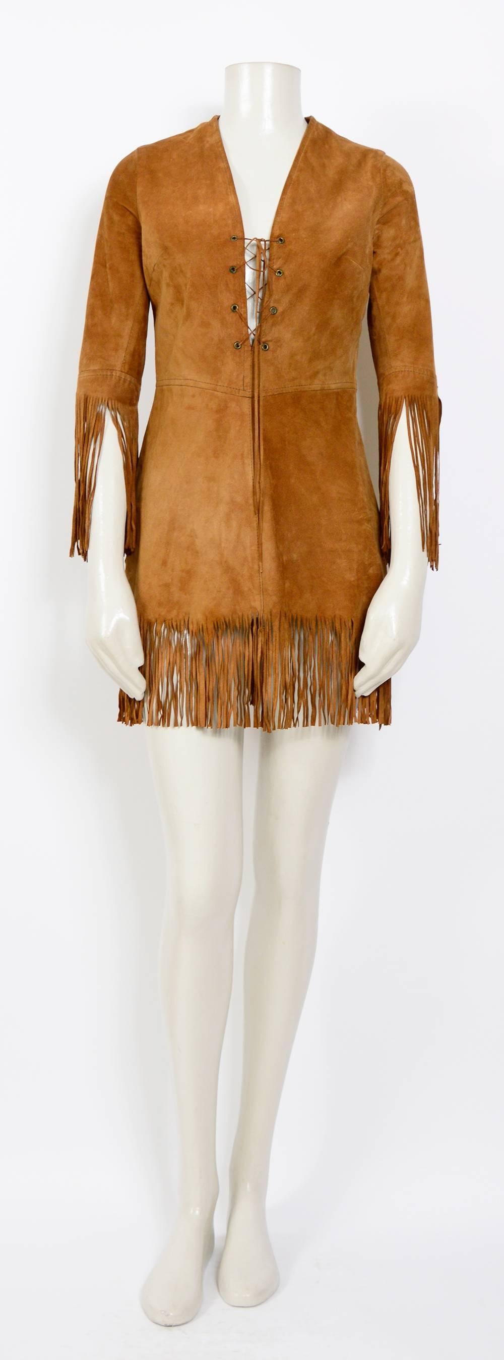 1960's suede festival fringe dress.
The dress is lined and has a zip on the side 
Measurements taken flat:
Sh to Sh 14inch/36cm - Ua to Ua 17inch/43cm(x2) - Waist 14inch/36cm(x2) - Hip 20inch/51cm - Total Length with fringes 32inch/82cm
