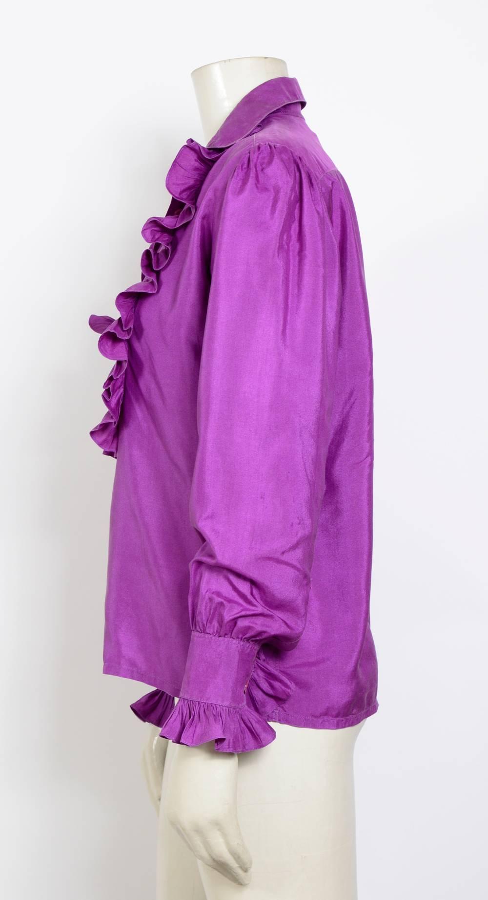 Lovely ruffle silk shirt by Yves Saint Laurent.
Measurements are taken flat: 
Sh to Sh 15inch/38cm - Ua to Ua 20inch/51cm(x2) - Waist 20inch/51cm(x2) - Sleeve 22inch/56cm - Total Length 24inch/61cm 