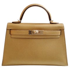 Hermès Mini Kelly Dore Metallic Gold Chèvre Olympic 2024 Champagne HW NEW