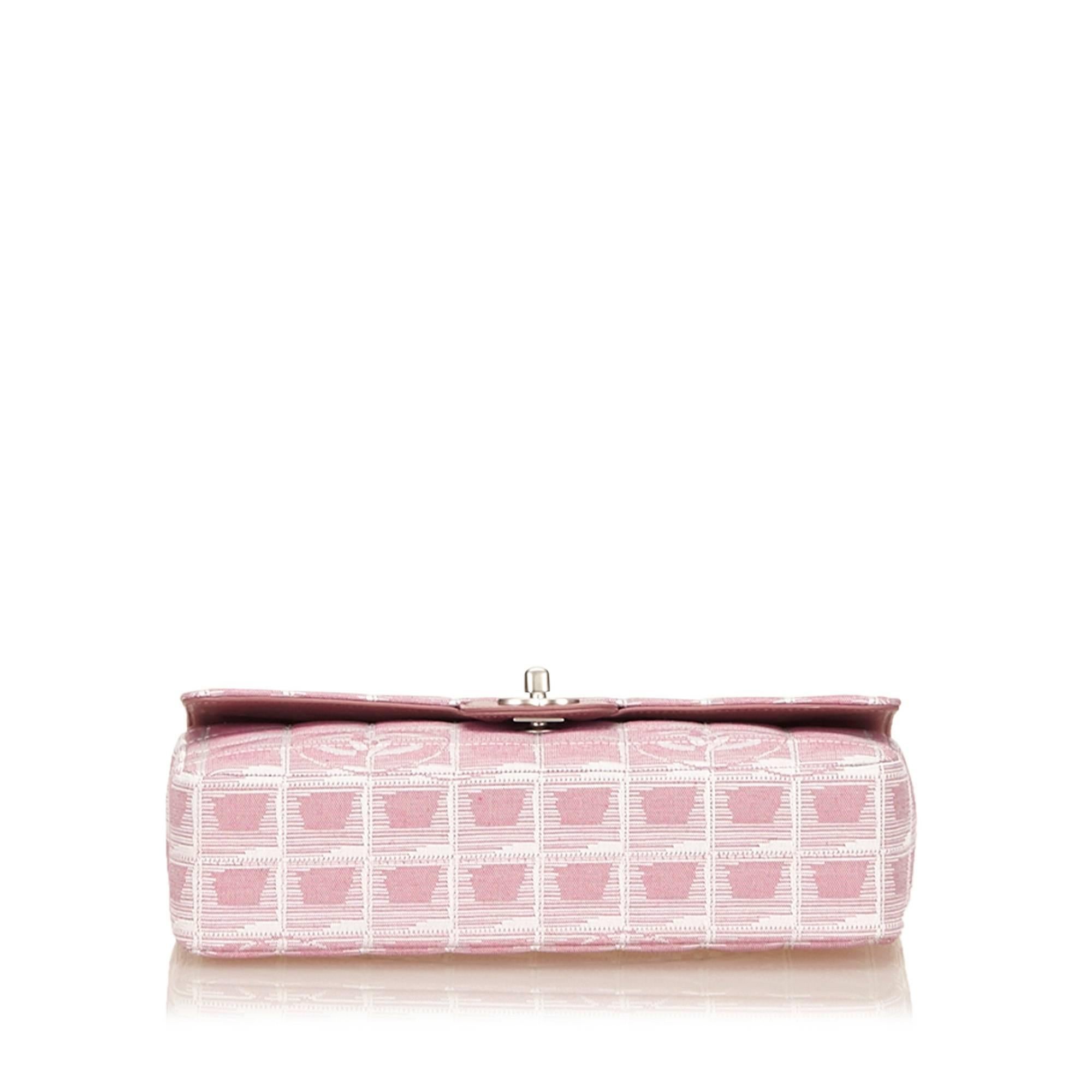 This shoulder bag features a quilted canvas body, silver-tone shoulder chains, an exterior slip pocket, a front flap with interlocking Cs and a twist lock closure, and interior slip and zip pockets.

Color: Pink