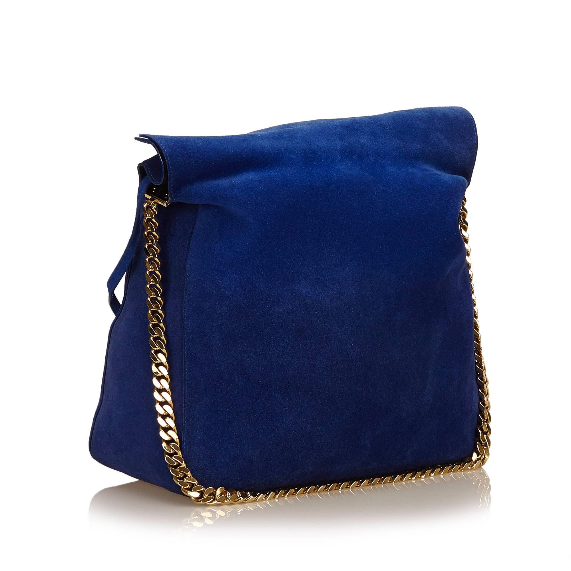 The Gourmette Bag features a suede leather body, gold-tone shoulder chain, and a flap top.

It carries a B+ condition rating.

Dimensions: 
Length 30 cm
Width 32 cm
Depth 14 cm
Shoulder Drop 35 cm

Inclusions: Pouch

Color: Blue

Material: Leather x