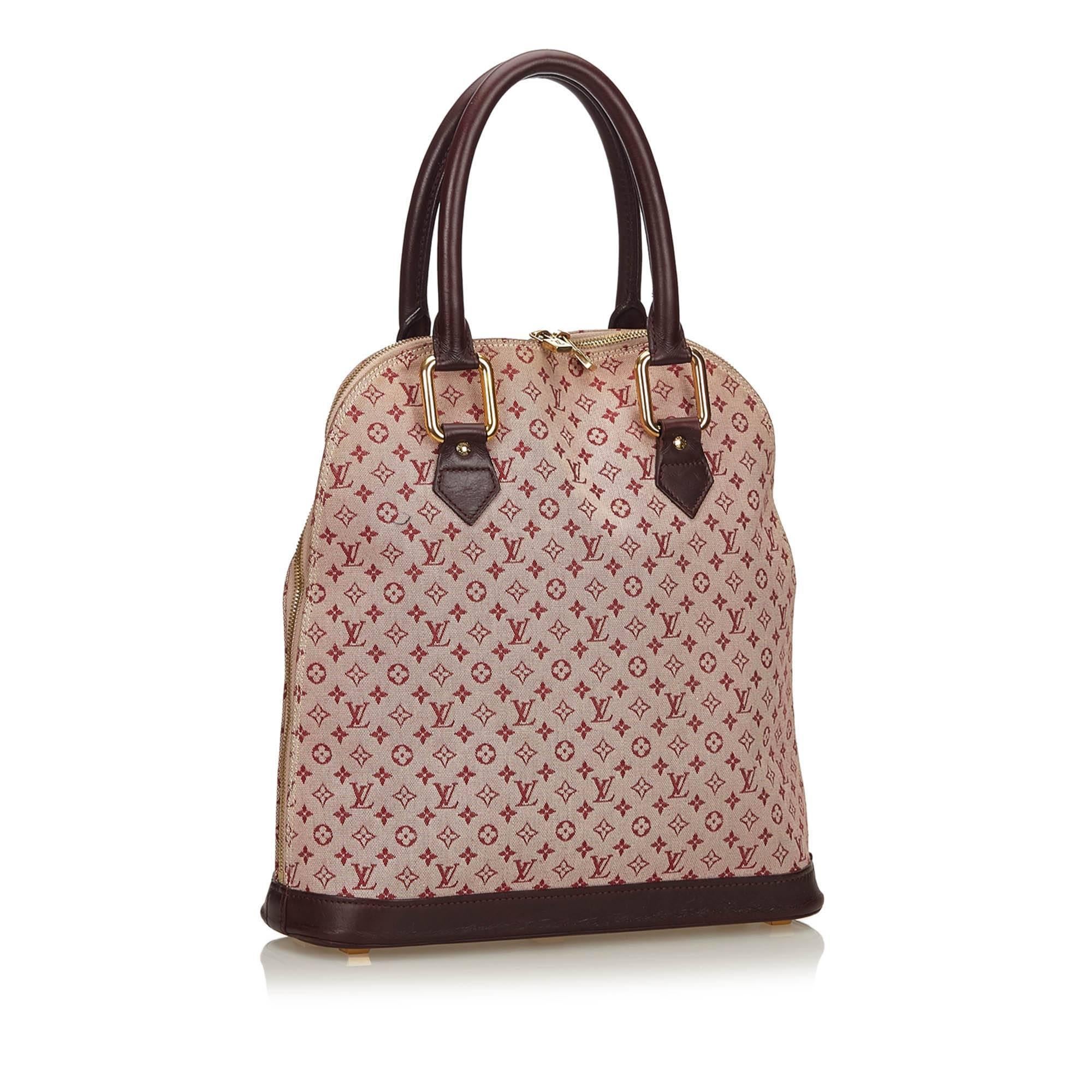 The Alma Haut features Mini Lin jacquard body, rolled leather handles, top zip closure, and interior zip and open pocket

It carries a B+ condition rating.

Dimensions: 
Length 33 cm
Width 32 cm
Depth 10 cm
Hand Drop 13 

Inclusions: Dust Bag,