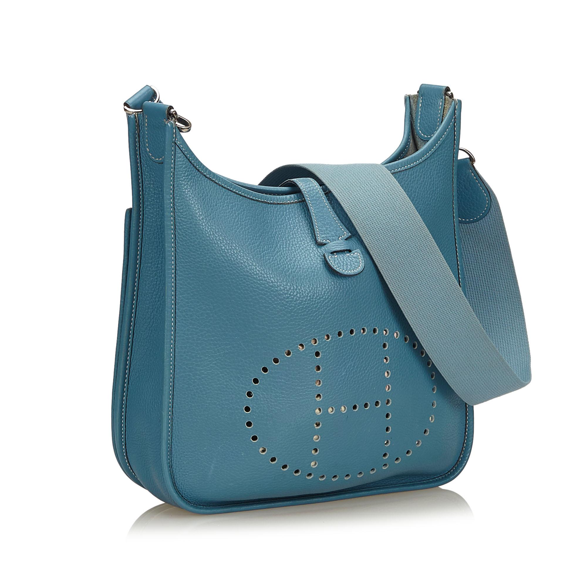 The Evelyne PM features a leather body, a detachable flat leather strap, a top strap closure, and an exterior slip pocket.

It carries a AB condition rating.

Dimensions: 
Length 27 cm
Width 28 cm
Depth 9 cm
Shoulder Drop 49 

Inclusions: No longer