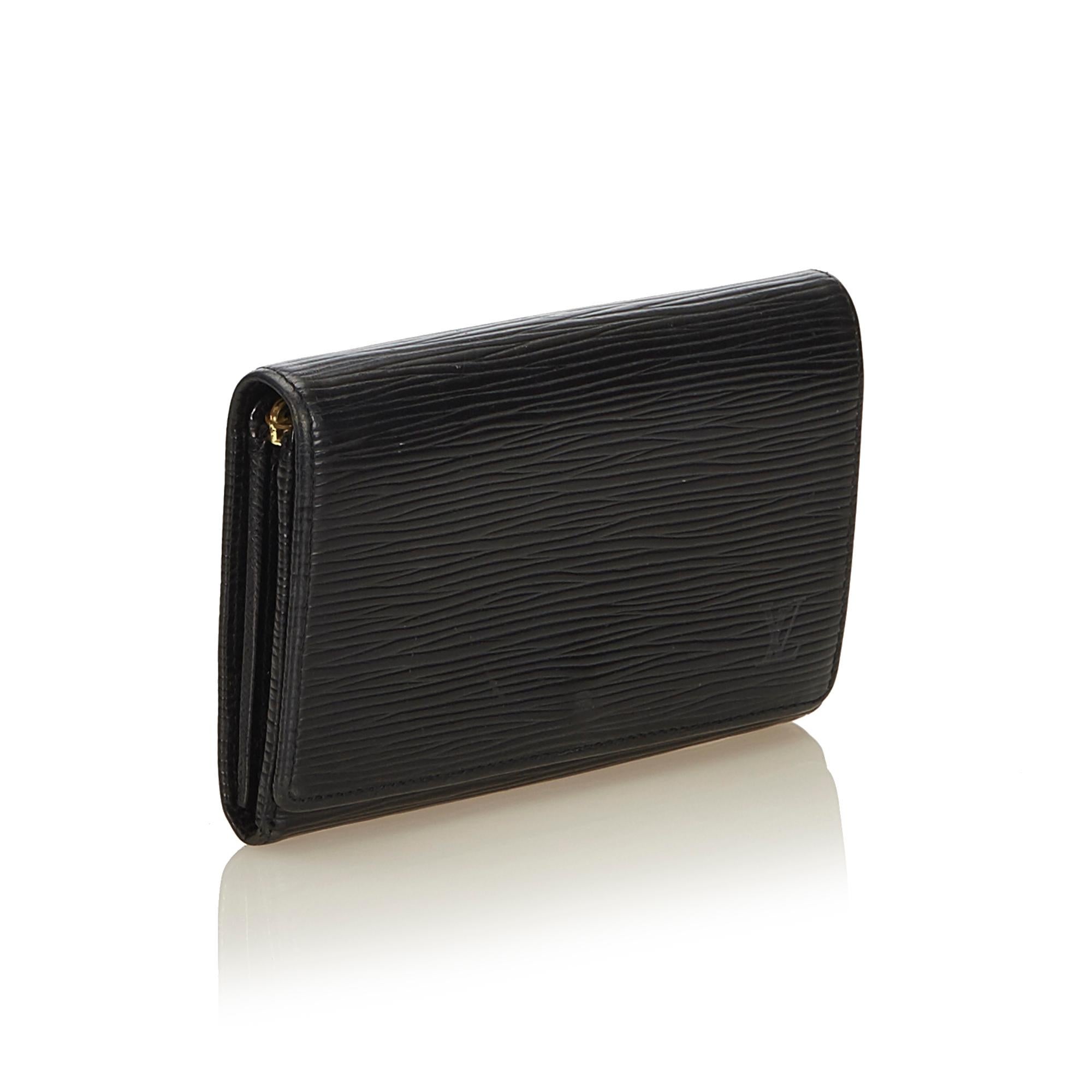 The Portefeuille Tresor wallet features an epi leather body, front flap with snap button closure and interior zip pocket.

It carries a B+ condition rating.

Dimensions: 
Length 9.00 cm
Width 14.00 cm
Depth 0.00 cm

Inclusions: No longer comes with